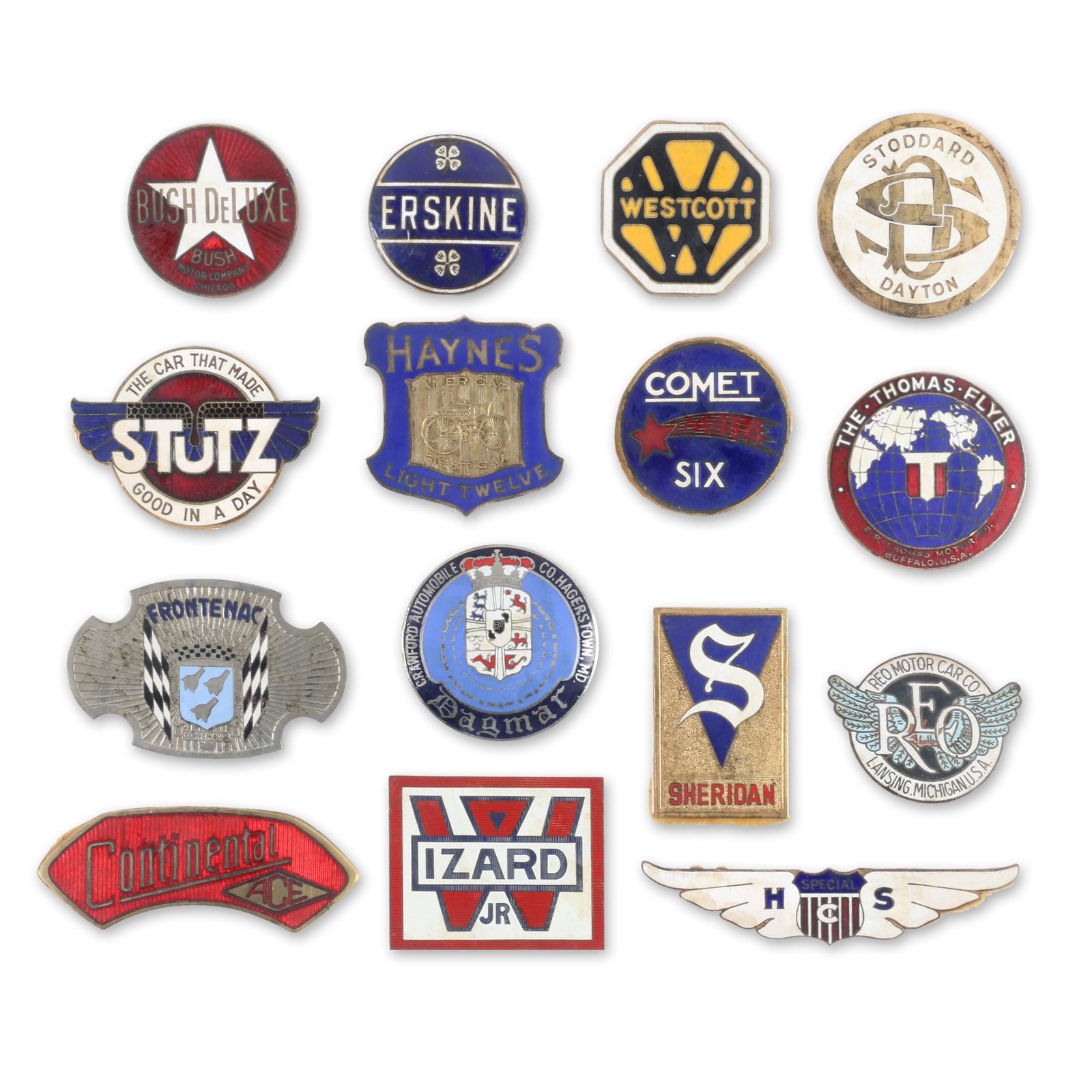 American Automobile Radiator & Grille Badges: Fifteen (15). Includes emblems marked, Frontenac, Sheridan, Haynes, Erskine, REO Motor Co, Comet Six, The Thomas Flyer, Stutz, Wizard Jr., Dagmar, Bush Deluxe, HCS, Westcott, Stoddard Dayton & Contine