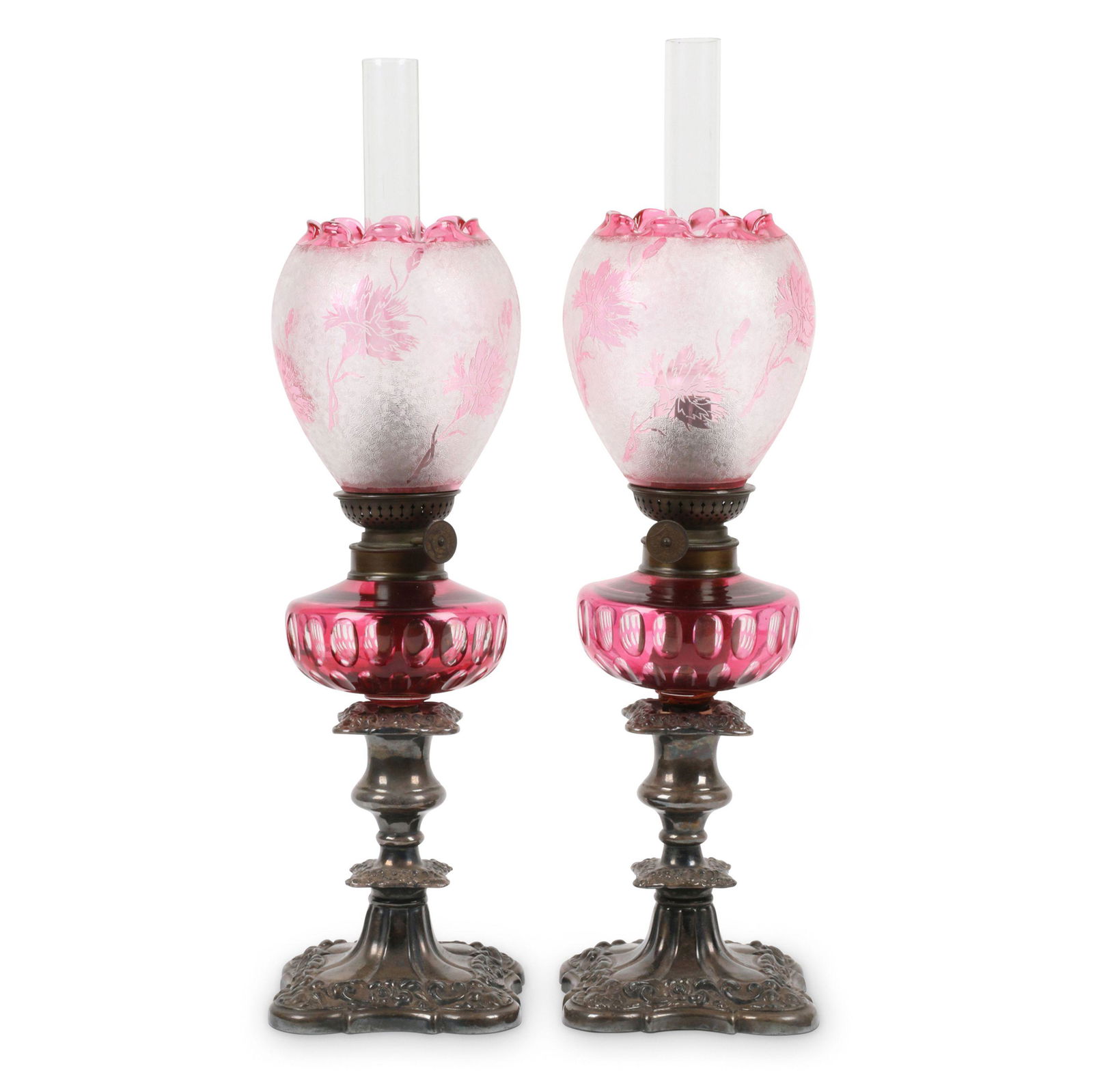 Pair of Cranberry Flashed Peg Lamps and Shades: Two (2). English. Glass, metal. Cut to clear, with Art Nouveau style floral decorated shades with crimped tops, in low silver plated candlesticks. 17". Brass mount lacking on one. Don Pero Collection.