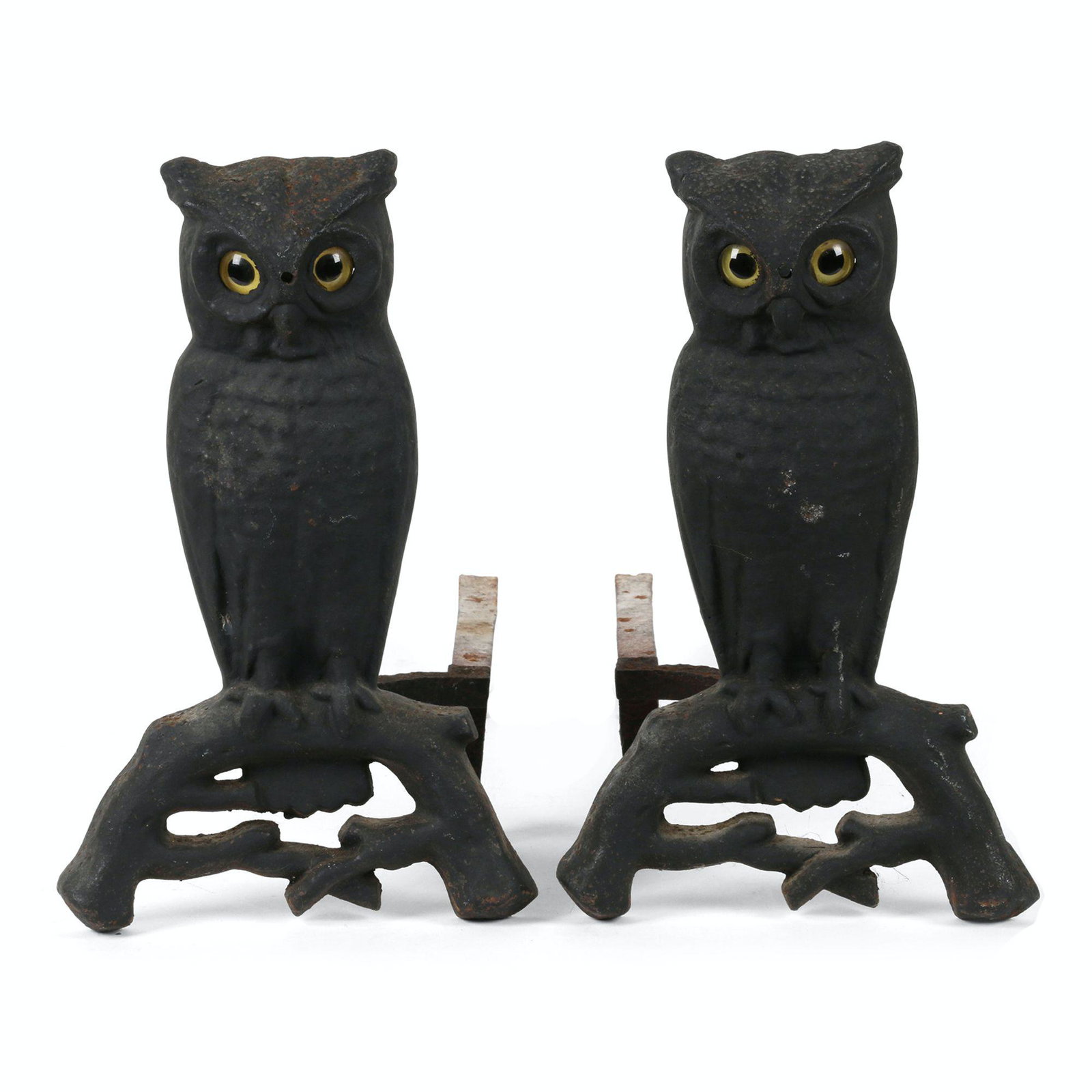 Cast Iron Owl Andirons: Cast Iron. Indiscernible casting stamps to rear. 15" x 9" x 18 each. One glass eye exhibits an edge chip. $300/500.