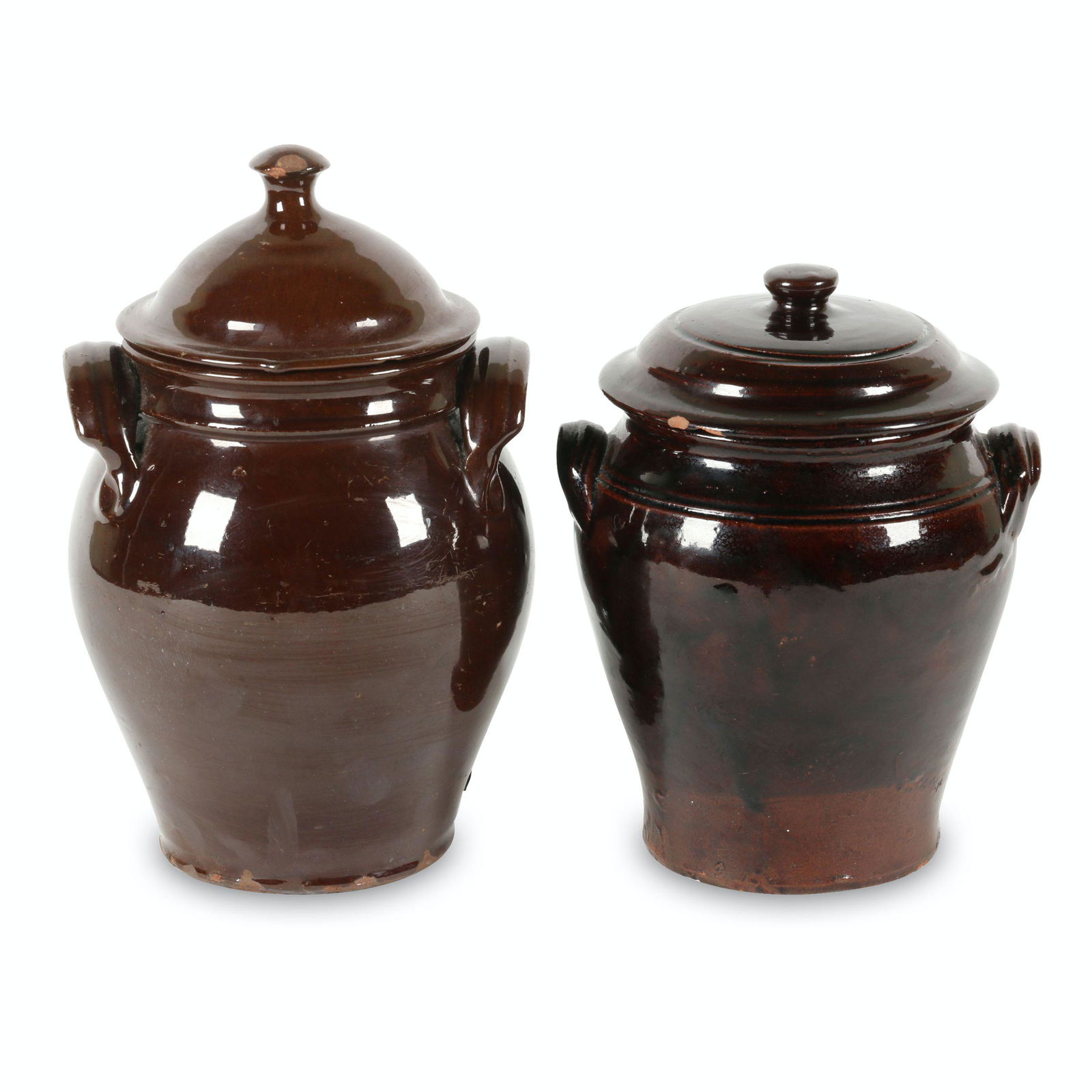 Ontario Redware Covered Jars: Two (2). Canadian. Earthenware. Each coated in brown albany slip glaze. Likely intended for tobacco or sugar storage. 8.25" to 10" (h). Larger example noted, "KITCHENER", smaller example noted, "OLD G