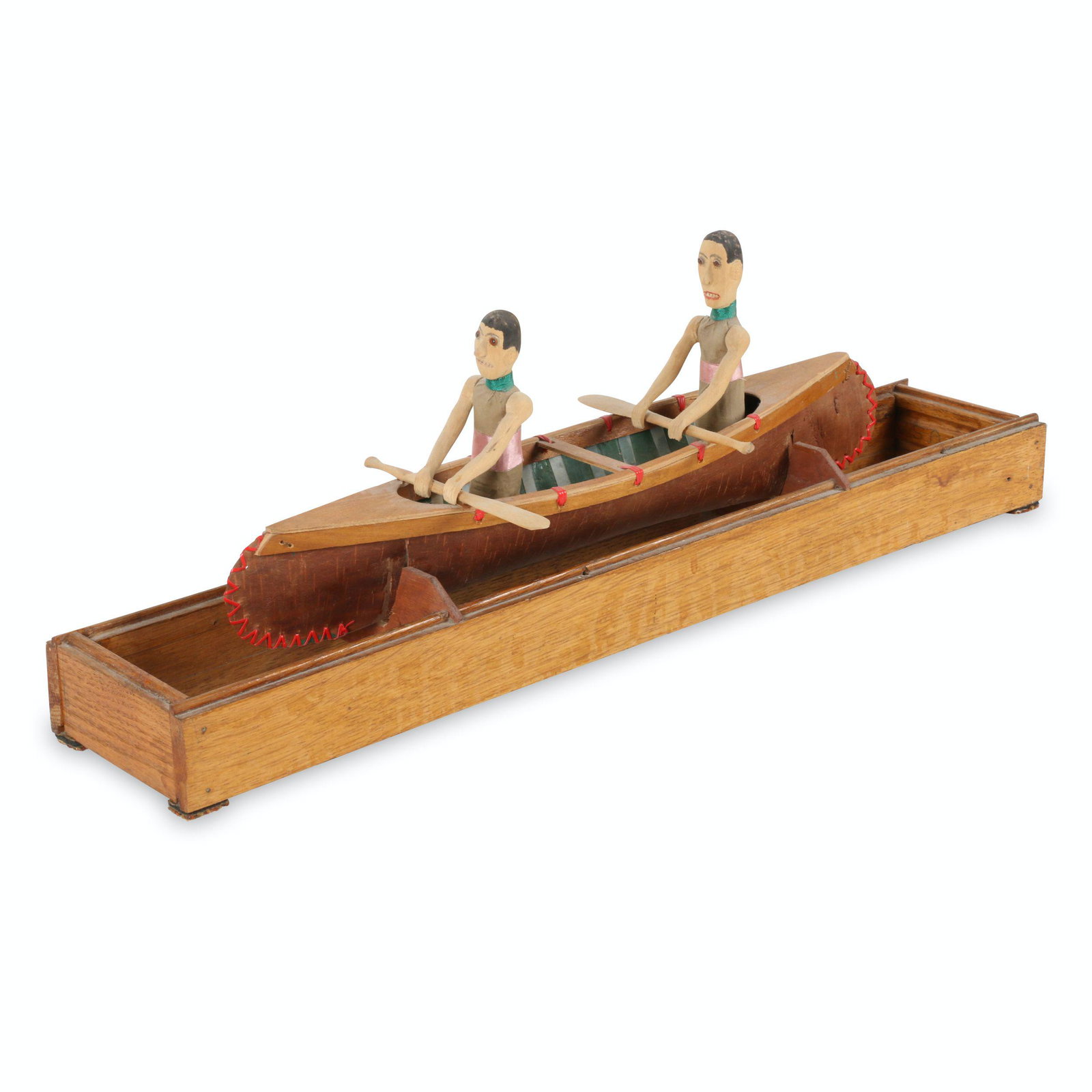Canoeists Folk Art carving: Canadian. 1950s. Wood. Hand carved canoeists in a miniature birch bark canoe on a display stand. Marked "Bruce USA" but originates from Midland, Ontario. Featured in the 2019 Bowmanville Antique Show 