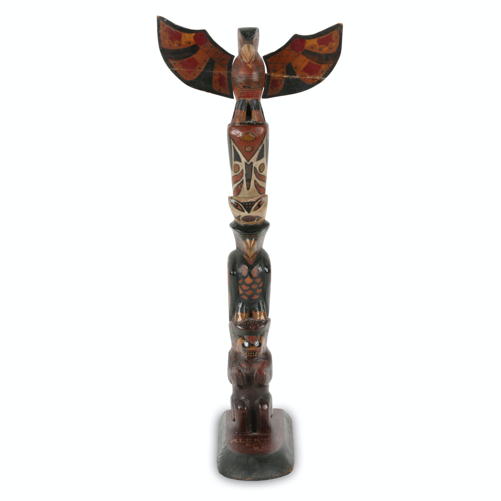 Alert Bay Totem Pole: Canadian. 1st quarter 20th C. Carved wood in original paint. Signed 'Alert Bay B.C' with native images of a bear, eagle and thunderbird. Glue repair to split wings. 15.75" tall. Jim/Ilona Fleming Coll