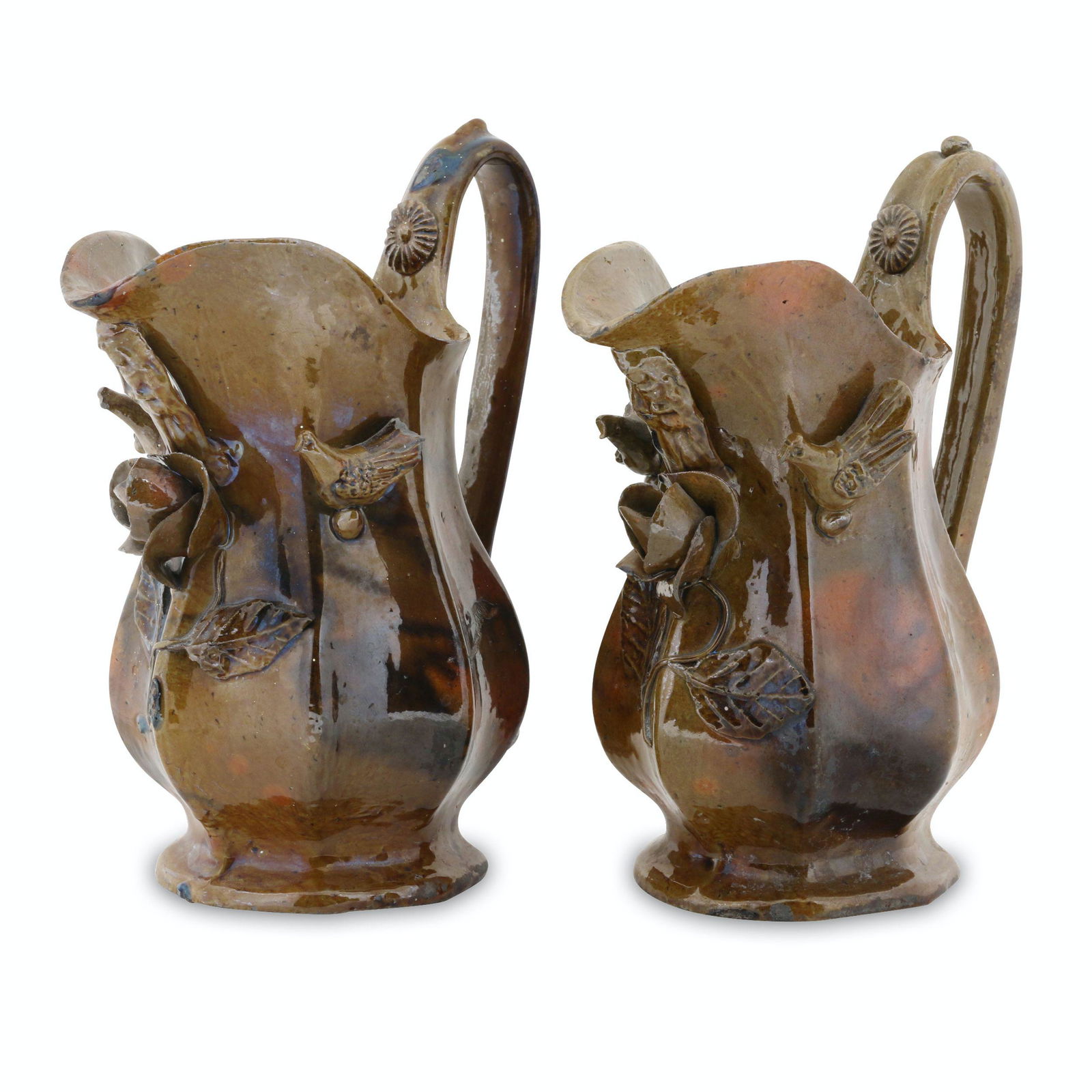 Decorated Redware Cream Pitchers: Two (2). Probably European. Earthenware. 7" x 6" x 3.5" each. Each noted, "DOVER NH AREA". Minor base edge and rim flakes. A few fleabites from the applied decoration. John Wine Collection. $300/500.