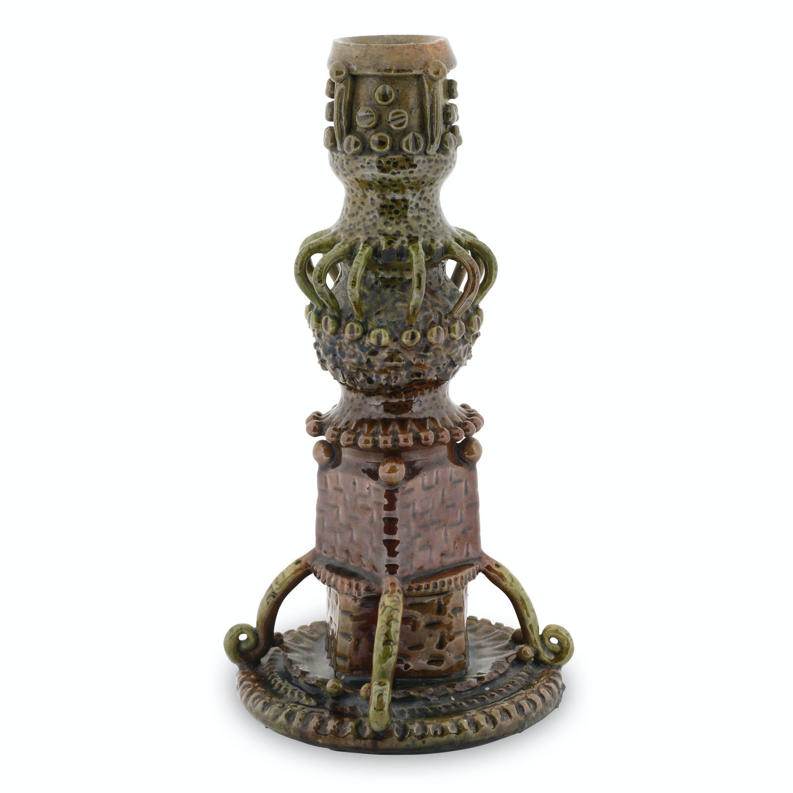 Redware Candle Holder: Canadian. Earthenware. Exhibits attributes of pottery found in Pennsylvania. 10.5" x 5" x 5". Noted, "See Klein plate 178 for Germanic influencer" "Similar to Anthony W. Baecher Shanendoah". Seven bro