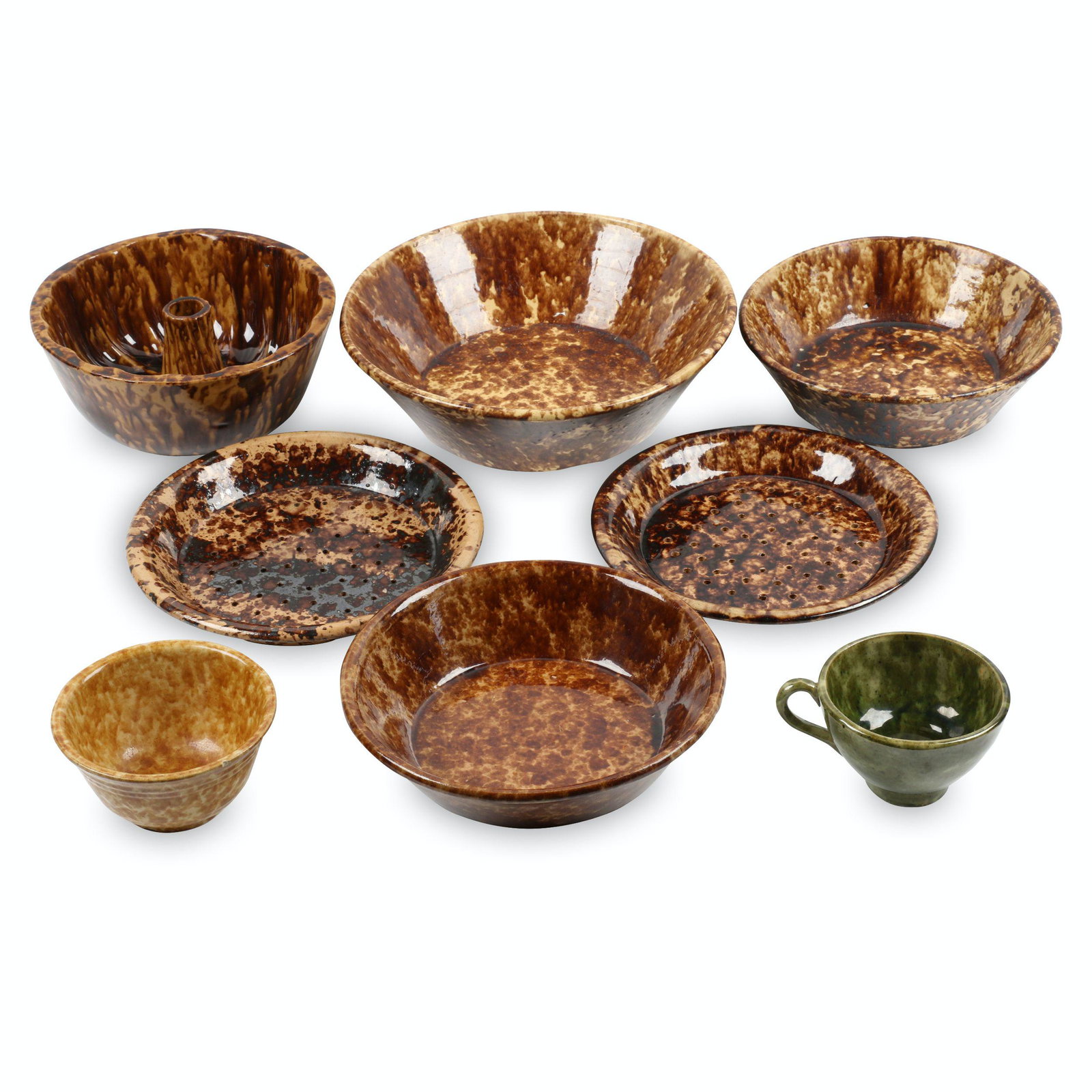 Bennington Pottery Baking Dishes and Plates: Eight (8). Canadian. Pottery. Two pierced pie plates, cake mould, three nappy bowls, small bowl and green jar funnel. Various sizes. Rim chip to small bowl and nappy, reglued chip to large nappy. Don 