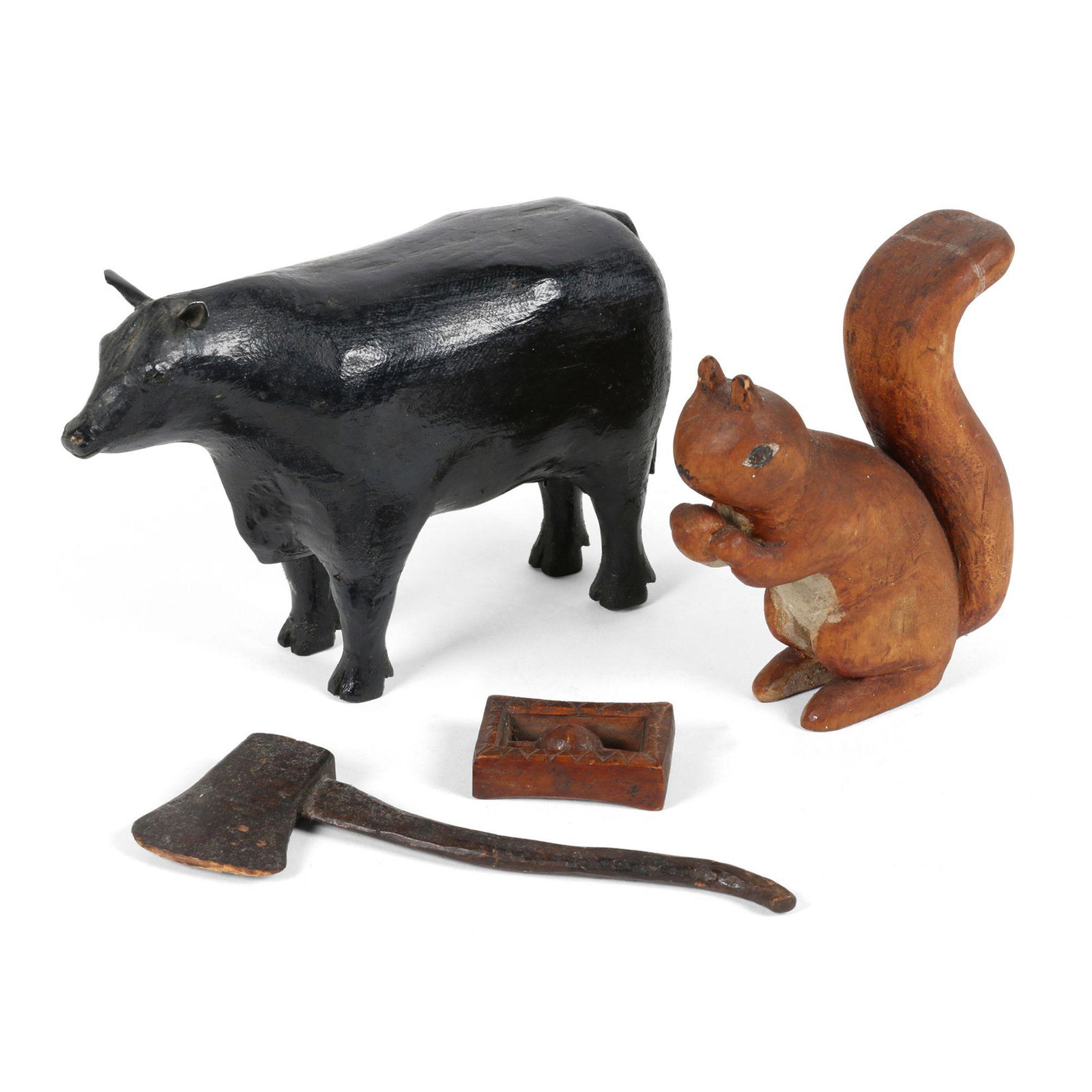 Collection of Folk Art Carvings: Four (4). Canadian. 1950s. Wood. Four hand painted folk art carvings including a bull, squirrel, axe and whimsey. 8.5" x 3" x 6". Don Pero Collection. $150/250.