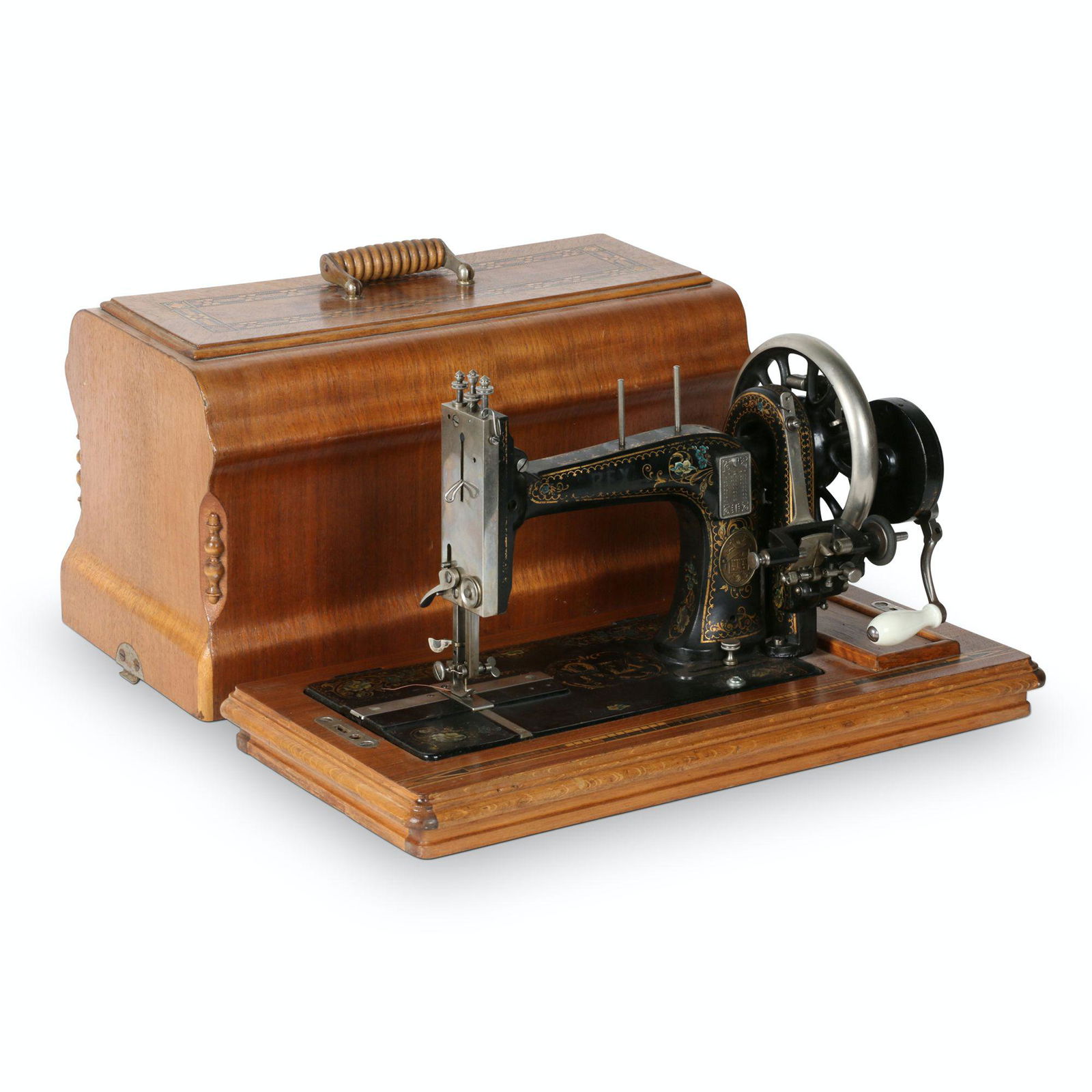 Rex Singer # 12 Copy Sewing Machine: American. 20” x 10.25” x 12.5”H The REX sewing machine is a copy of the Singer Model 12, one of the most copied sewing machines, the other being the Singer Model 15. Est. $100-200. C