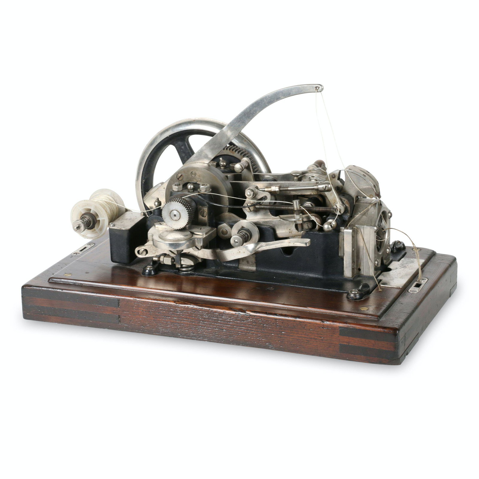 Frobana Wuppertal-Barmen Sewing Machine: German. 1900s. 21.25” x 12.25” x 13”H This is an industrial sewing machine for the shoe trade, used to stitch the sole to the shoe on the outside edge. It is known as a bent needle e
