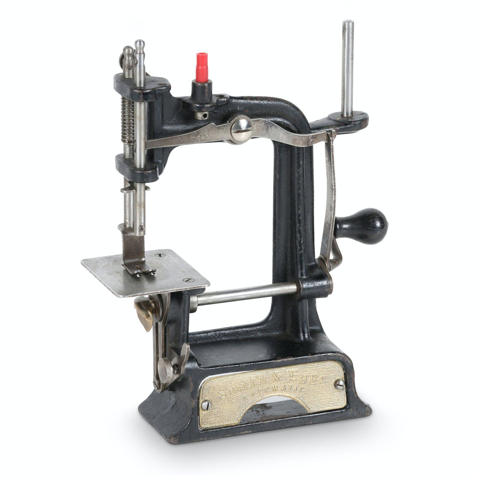 Smith & Egge Automatic Sewing Machine: American. 1900s. 6” x 2.5” x 6.75”H This tiny cast iron sewing machine was manufactured by the Smith & Egge Manufacturing Co. of Bridgeport, Conn. in the early 1900â€™s. It has 