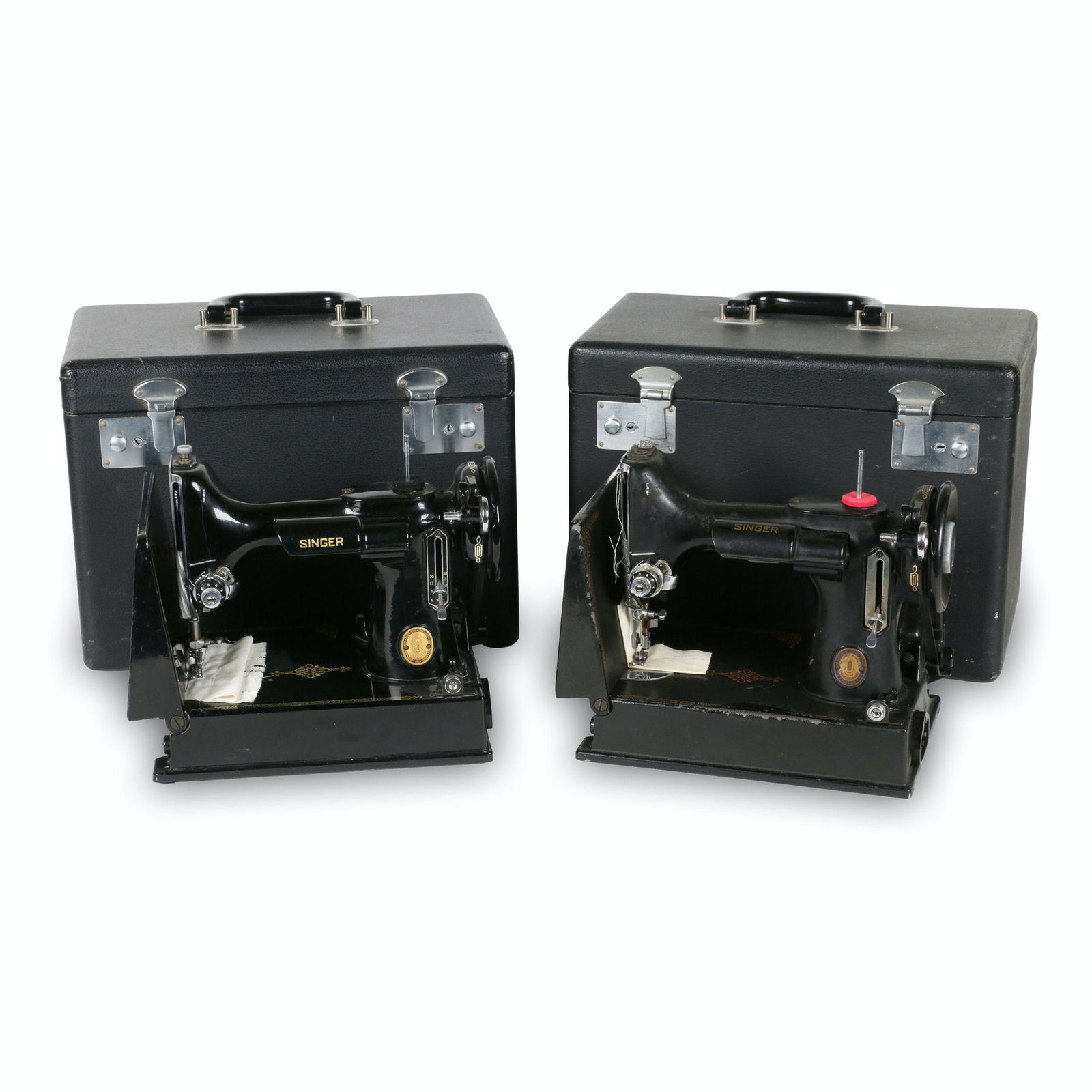 Two (2) Singer Featherweight Model 221s: American. 1950s. TWO (2) machines and two carrying cases (14.5” x 8.25” x 11.5”H) manufactured by the Singer Sewing Machine Manufacturing Co. between 1933 and 1968. The Model 221 is