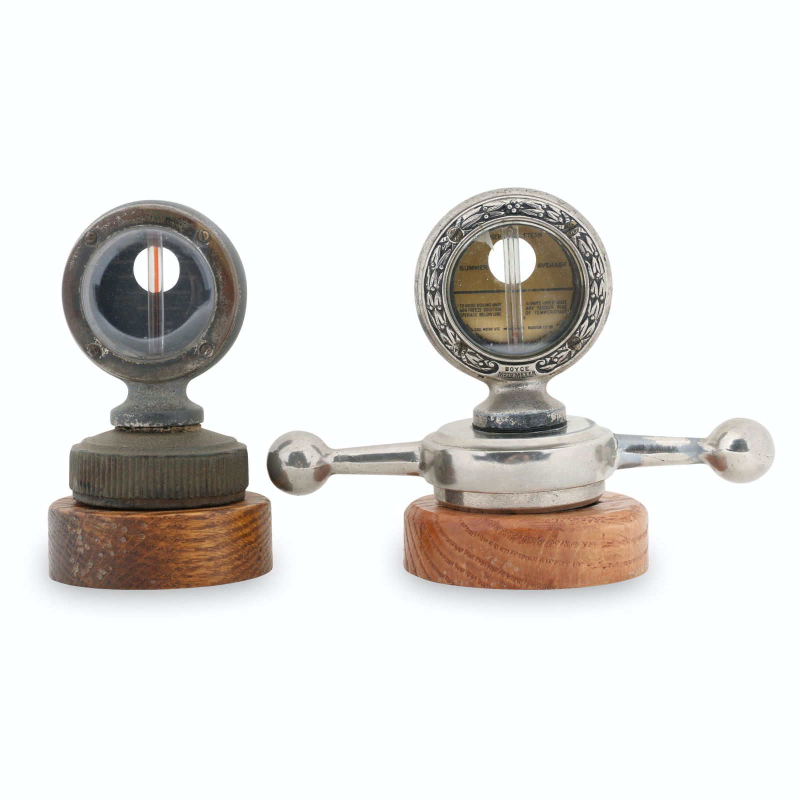 Star & Dealer Boyce Motometer Hood Ornaments: Two (2). American. 1920s. "Dog bone" Moto Meter marked, "A.D Gorrie & Co. Ltd, Toronto, Ontario. Other example marked, "Star Durant Motors". One stamped,"Fisher Motor Co., Orillia Canada"underside. 3.