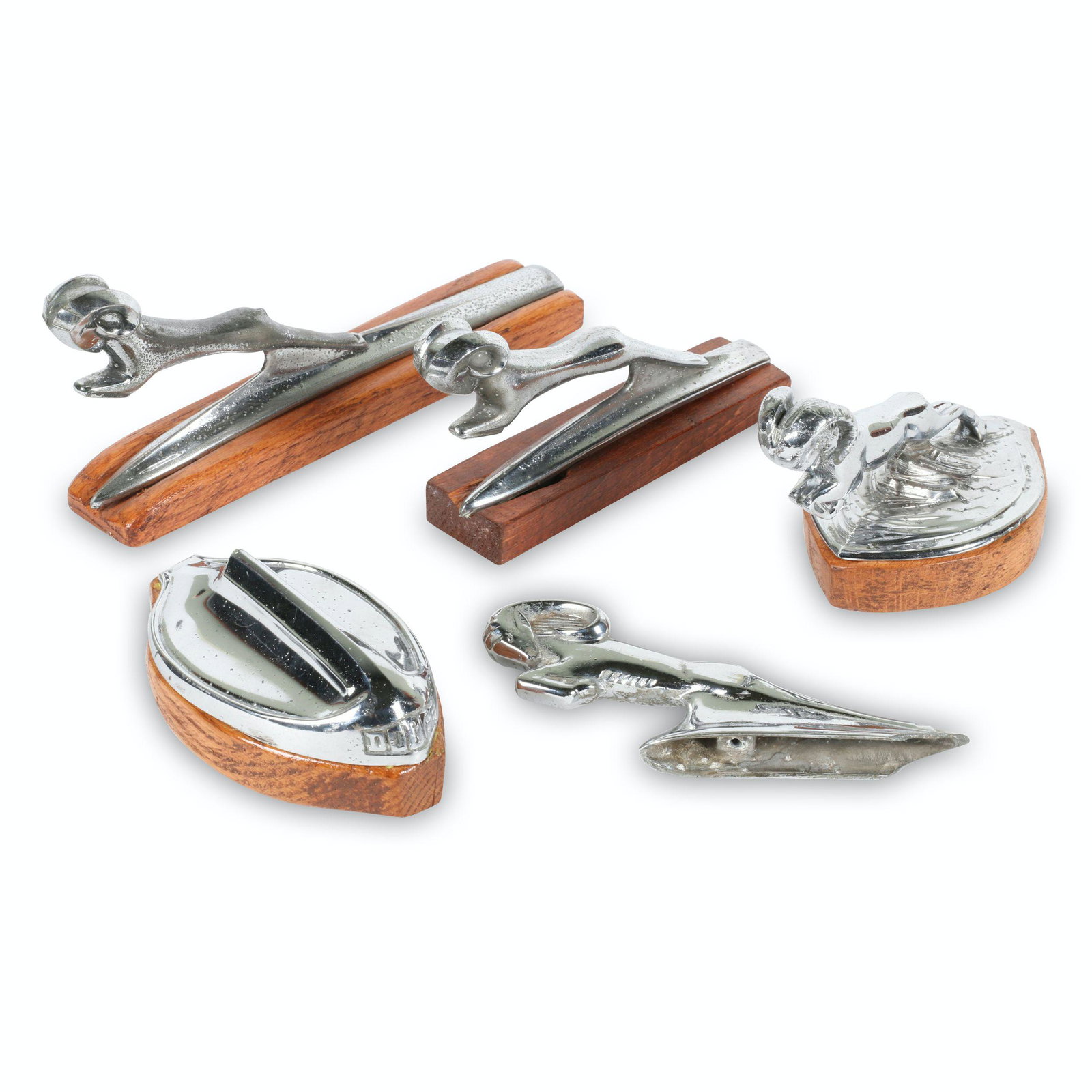 1930s Dodge Hood Ornaments: Five (5). American. 1930s. Includes 1932 rad cap, 1933-34 Ram, 1935 Ram, 1938 Ram Dodge.. Marked, "DCPD - 768944 - 3475-A" & "DCPD 383078" underside. 5.5" to 9" (l). Each exhibits minor to moderate su