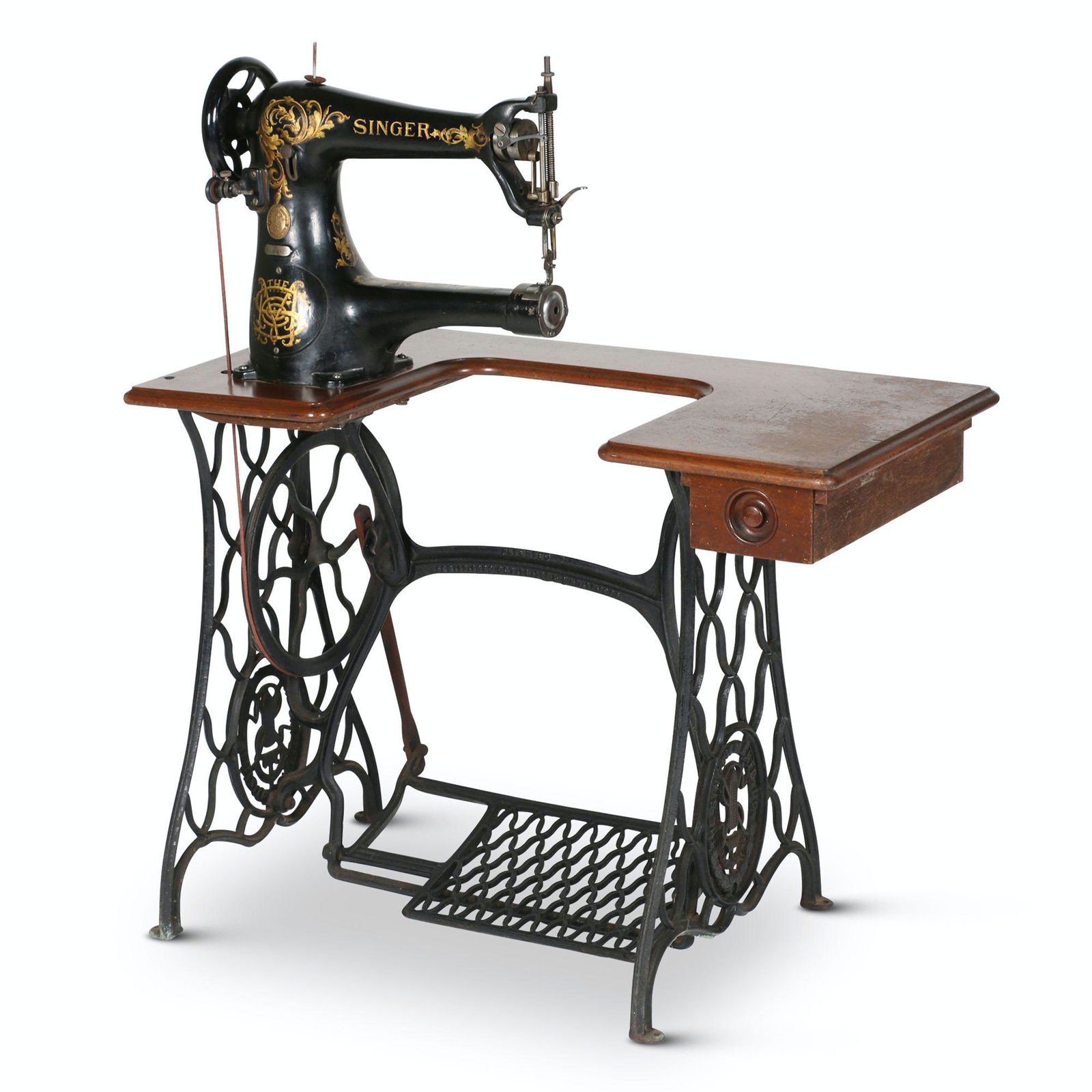 Singer Model 45W Industrial Sewing Machine: American. 1930s. 36” x 18” x 42”H Manufactured by the Singer Sewing Machine Co., this industrial free arm sews left handed; it was used in the shoe industry. It has a rotary hook mec