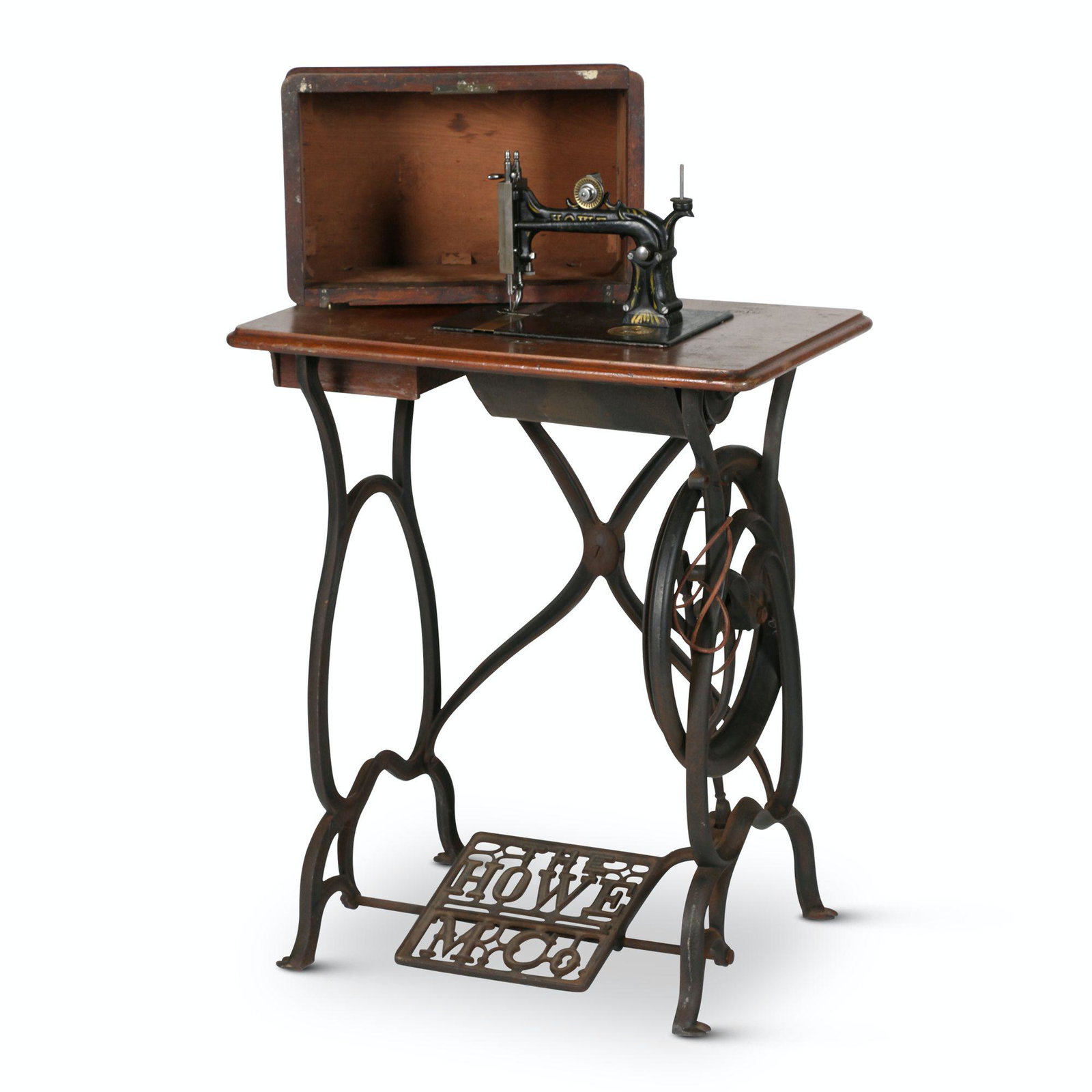Howe, Stockwell Bros. Sewing Machine: American. 1870s. 26” x 15” x 38” Manufactured circa 1870 by the Howe Manufacturing Company which was owned by the Stockwell Brothers. It has the typical Howe stand and the brass Meda