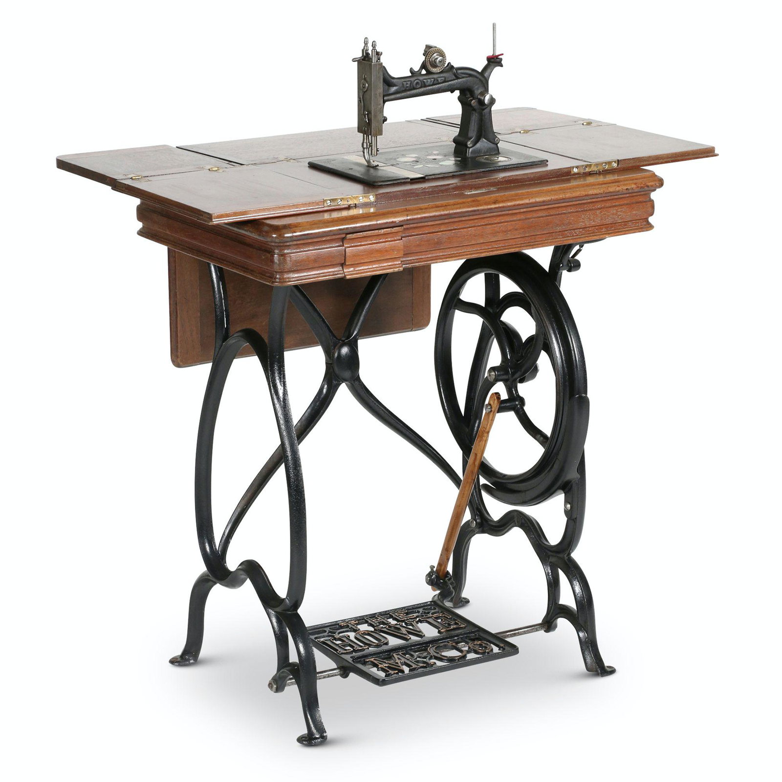 Howe, Stockwell Bros. Sewing Machine: American. 1870s. 26” x 17” x 39” Manufactured circa 1870 by the Howe Manufacturing Company which was owned by the Stockwell Brothers. The stand has a cover that unfolds to extend the