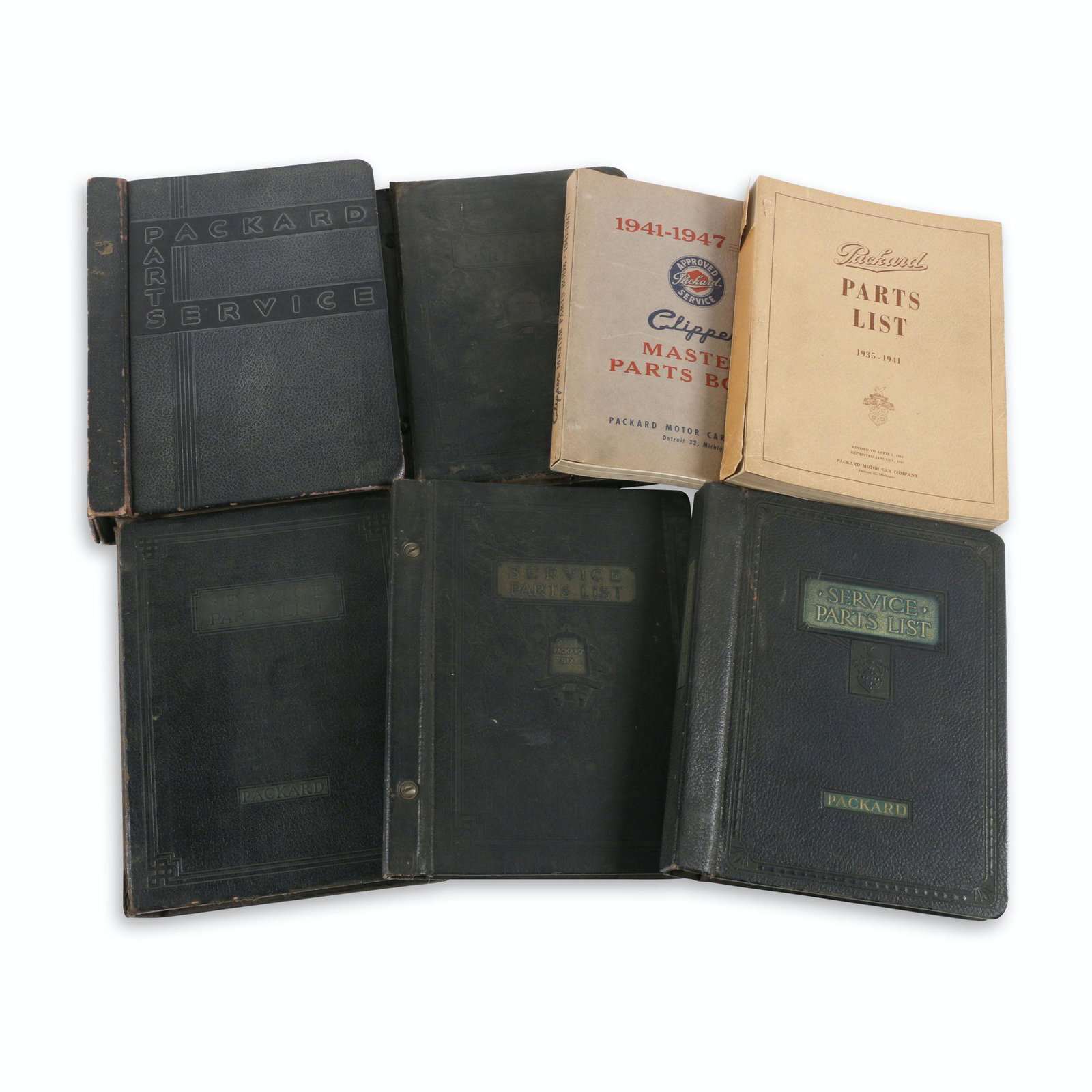 Packard 1930s-40s Service Parts Books: Seven (7). American. 1930s-40s. Approximately 11.5" x 9.5" each. Edgewear and minor to moderate soil. Impact and wear to covers of covers. $300/500