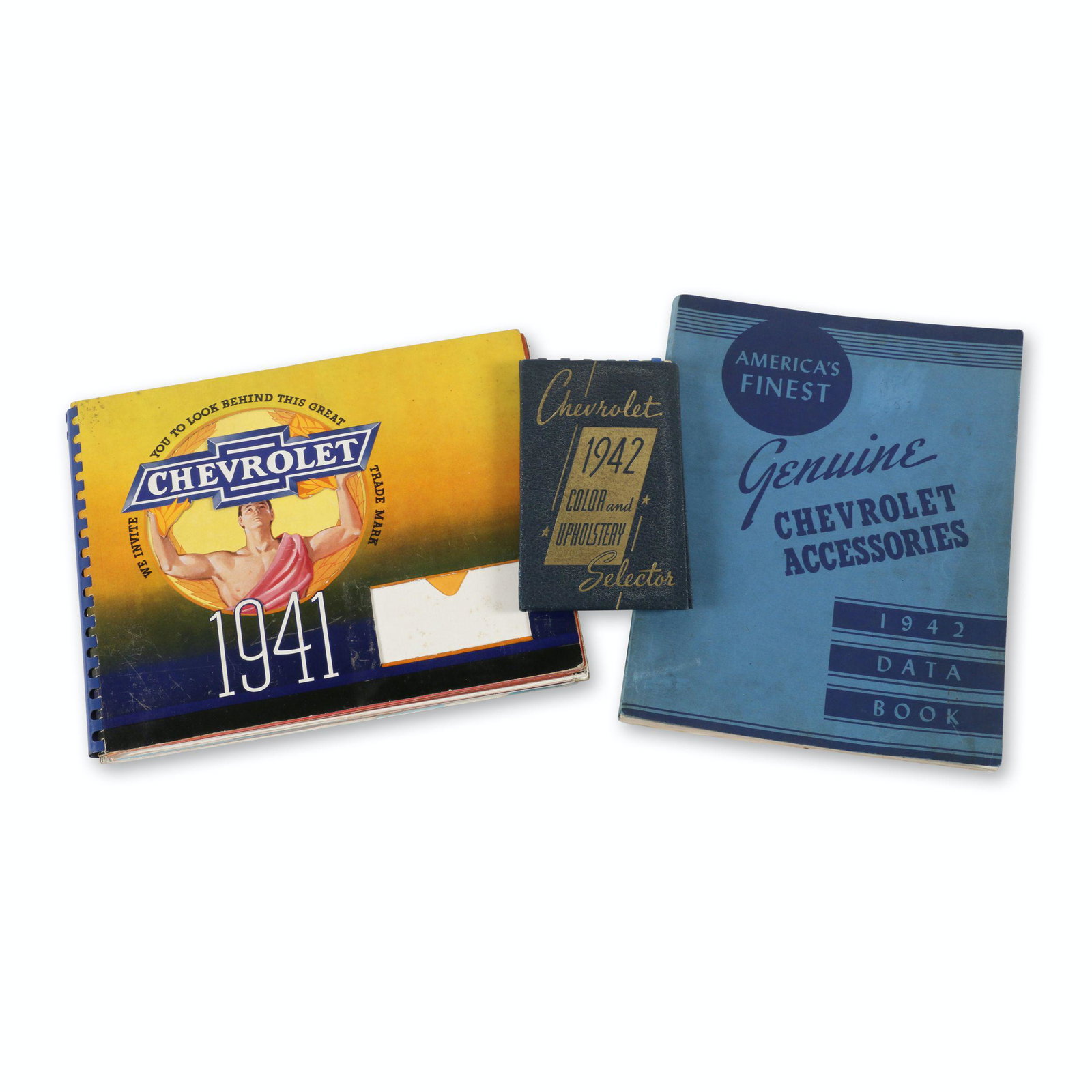 Chevrolet 1941 Dealer Album: Three (3). American. 1941. 6.5" to 12" (l). Includes 1941 dealer album and 1942 color and upholstery selector and accessories/data book. Upholstery swatches exhibit deterioration. Album complete with 