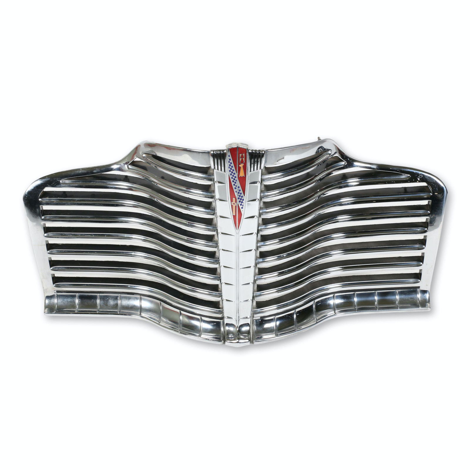 1941 Buick Chrome Grille & Emblem: American. 1941. Includes original box from the emblem that has been mounted to the assembly. Grille assembly is comprised of 4 pieces, the left and right grilles, the center, and the emblem. 41" x 18"