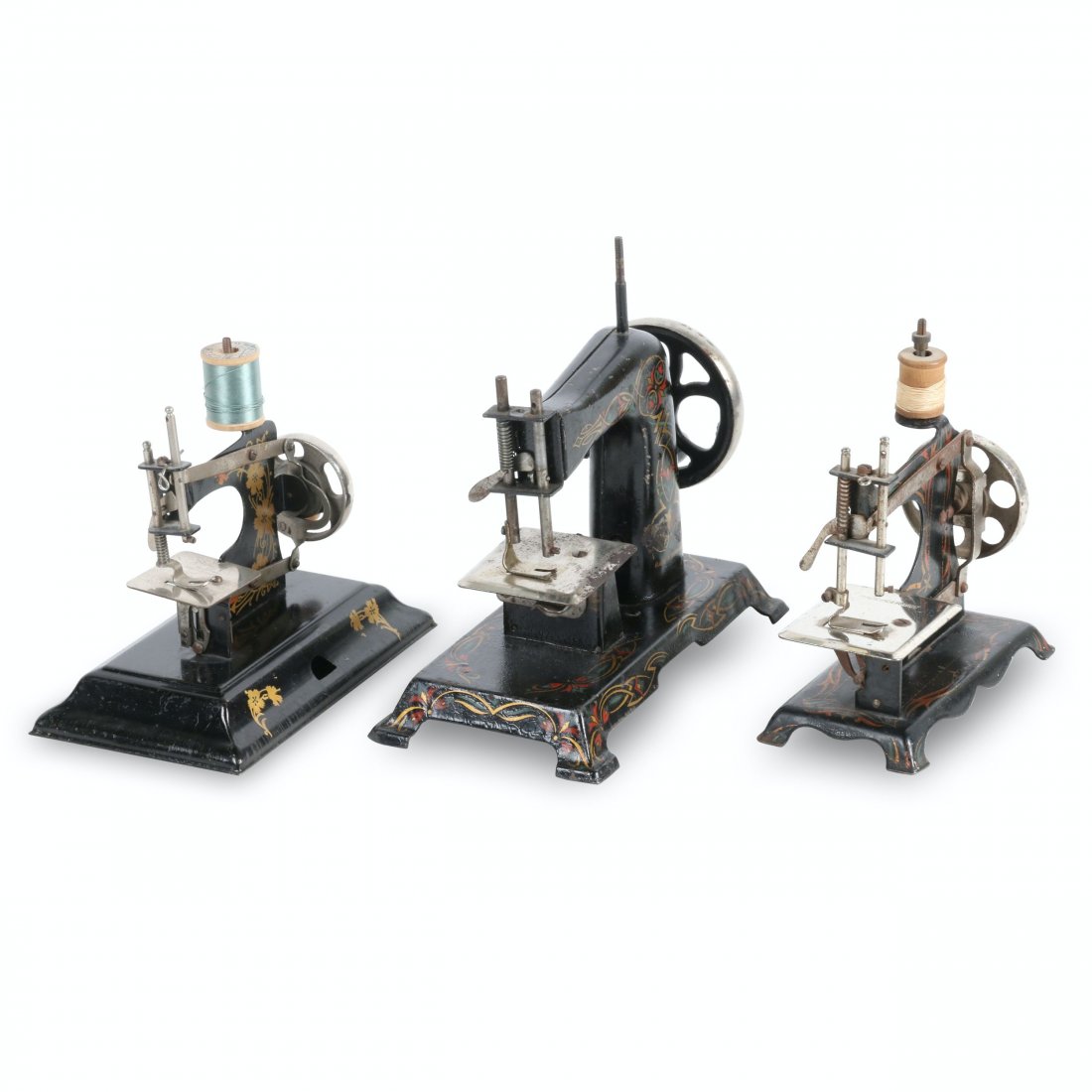 Muller & Casige Sewing Machines: German. Three (3). Consisting of one Müller and two Casige toy sewing machines. The Müller is a Model No. 10 with dimensions of 8.25” x 4.25” x 7.5”H. It was manufactured by F.W. Müller, Berl