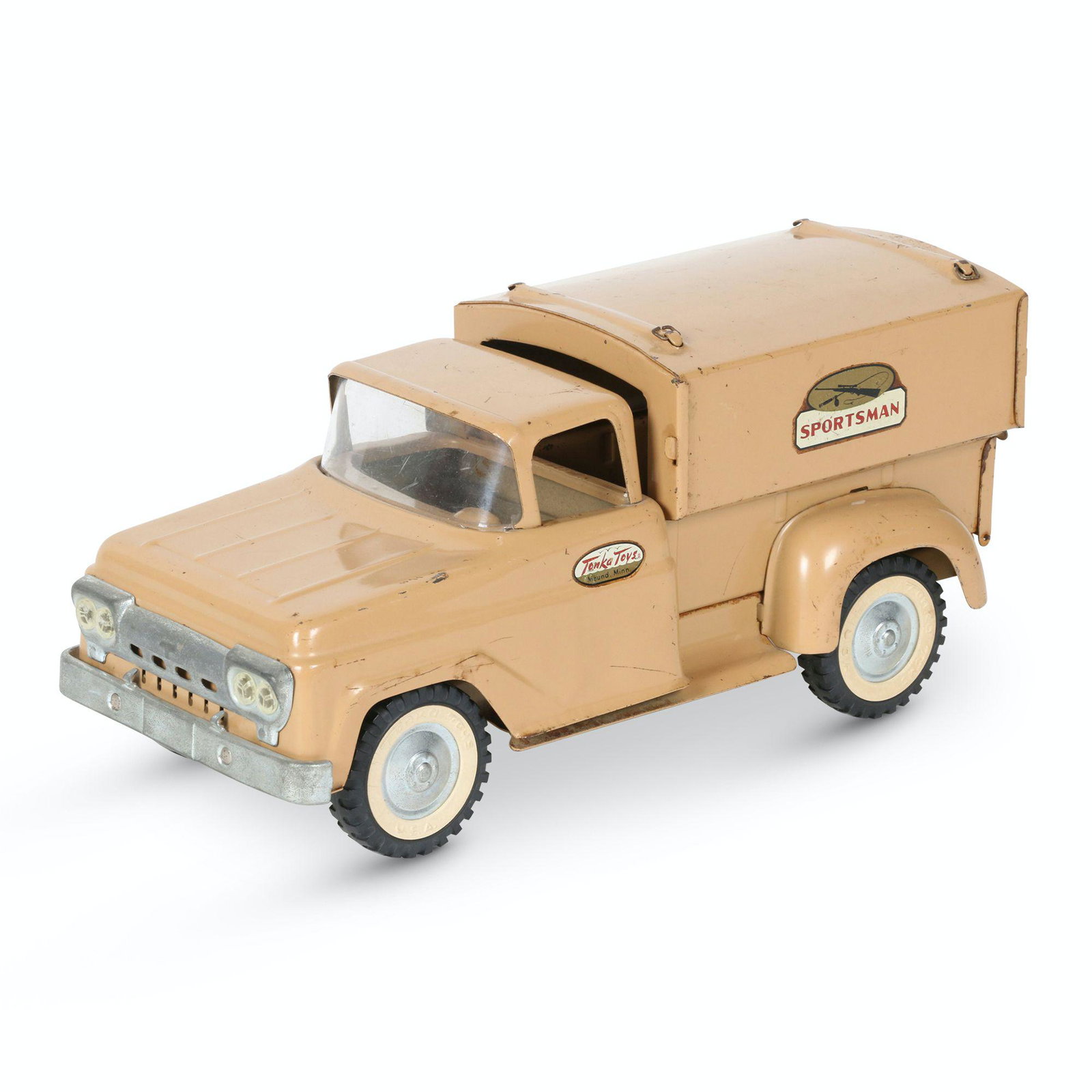 Tonka Pressed Steel Sportsman Pickup Truck: American. 1960s. Features removable cap. Marked, "Tonka Mound, Minn" doors. Wheels embossed, "Tonka Toys USA". 12.5 x 5.75 x 5.75". Scattered light surface scratches.