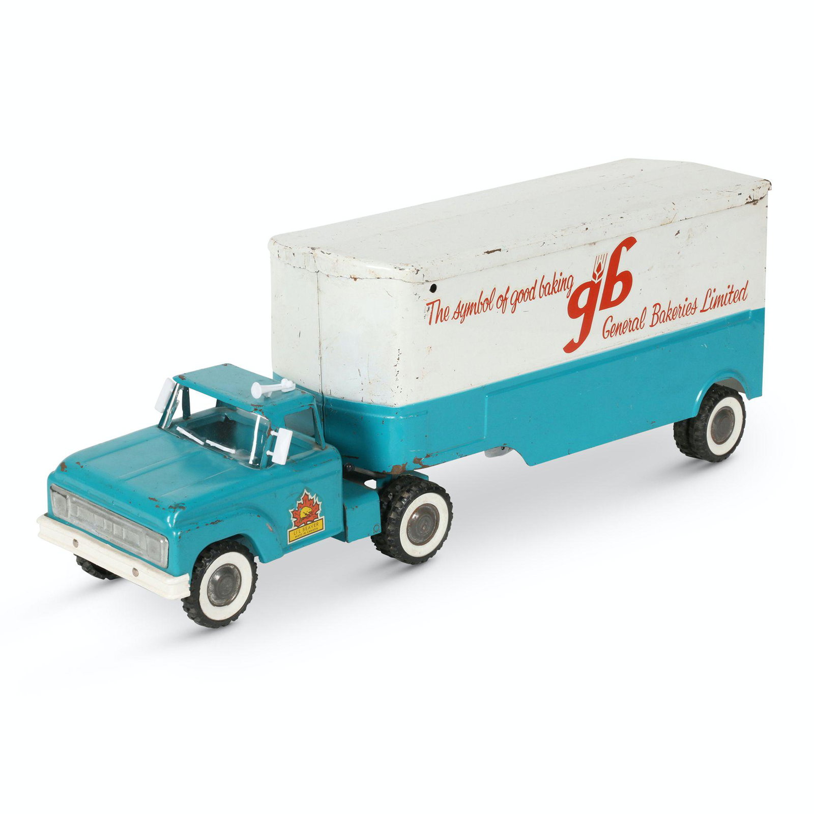 Li'l Beaver General Bakeries Transport Truck: Canadian. 1960s. Pressed steel with plastic and rubber components. Marked, "Li'l Beaver - Made in Canada" cab doors. 23.5 x 6" x 8.5" (h). Exhibits scattered minor scratches and oxidation. Replaced wi