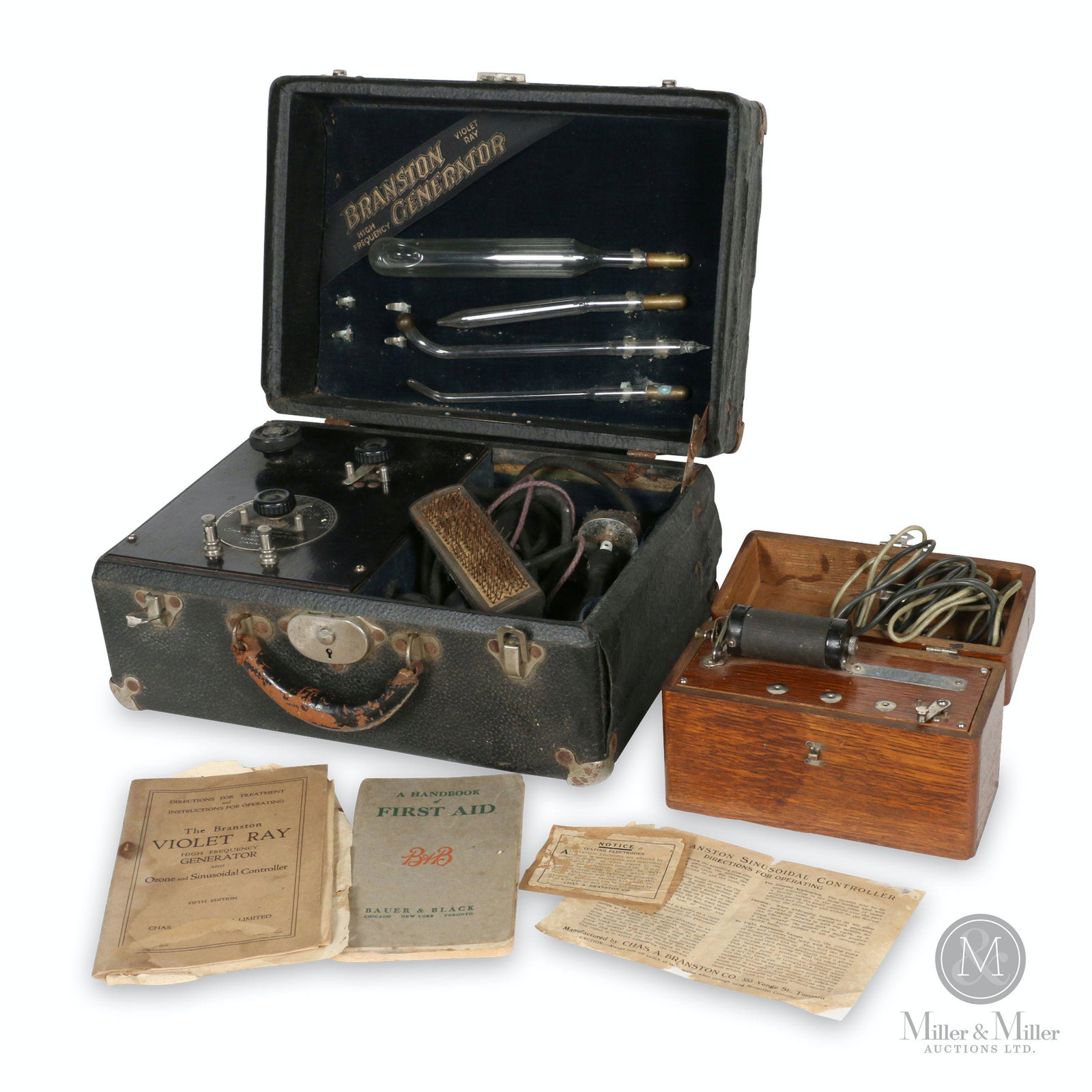 Two (2) Cased Medical Apparatuses: Two (2). Canadian. 1900s-1920s. Quack medicine. Larger unit marked, "Manufactured by Chas. A. Branson Company, Toronto, Canada - Branston Violet Ray High Frequency Generator". Smaller unit marked, "Pa
