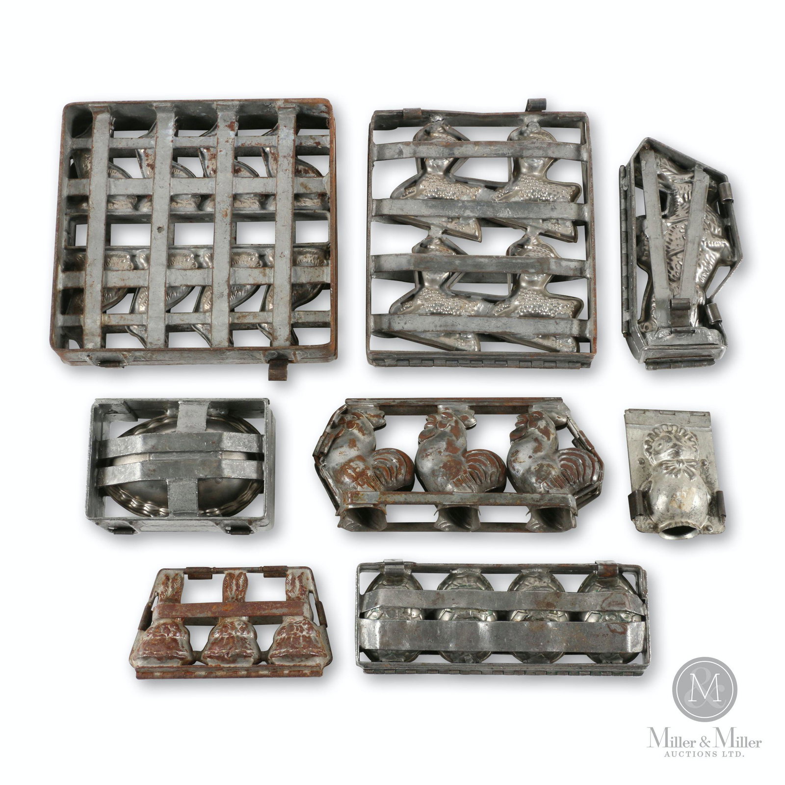 Assorted Easter Chocolate Molds: Seven (7). German & American. 1940s. Stamped steel. Markings include: Weygandt, "Made in Germany" and "Made in U.S.A". 4.25 to 11.25" (h). Some examples exhibit surface oxidation, plating wear and sha