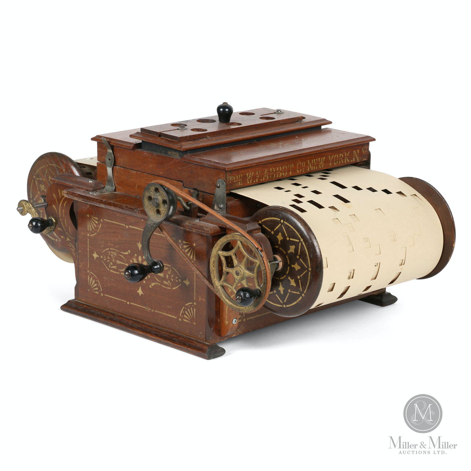 Automatic Melodista Roller Organ: American. 1900s. Stencilled wood case with cast and brass trim. Includes roll attachment and additional music scrolls. Marked, "Automatic Melodista" front lid. Marked, "The W. F Abbot Co., New York, N