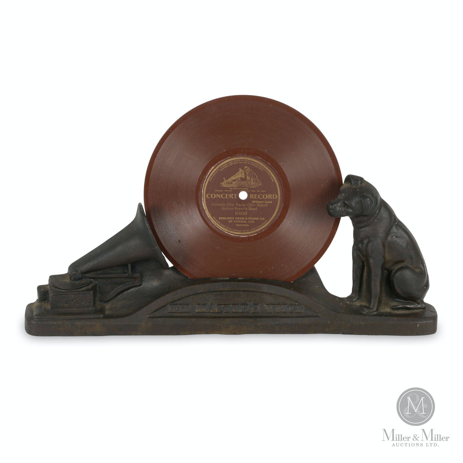 Cast Iron Victor Trademark Record Store Display Stand: Canadian. 1910s. Cast iron. NOTE: Record not included, shown for display purposes only. Stamped, "W.H. Rogers M'F'G Co.Des Reg Canada U.S. Pat App For" rear. 14 x 1.75 x 5.25" (h).