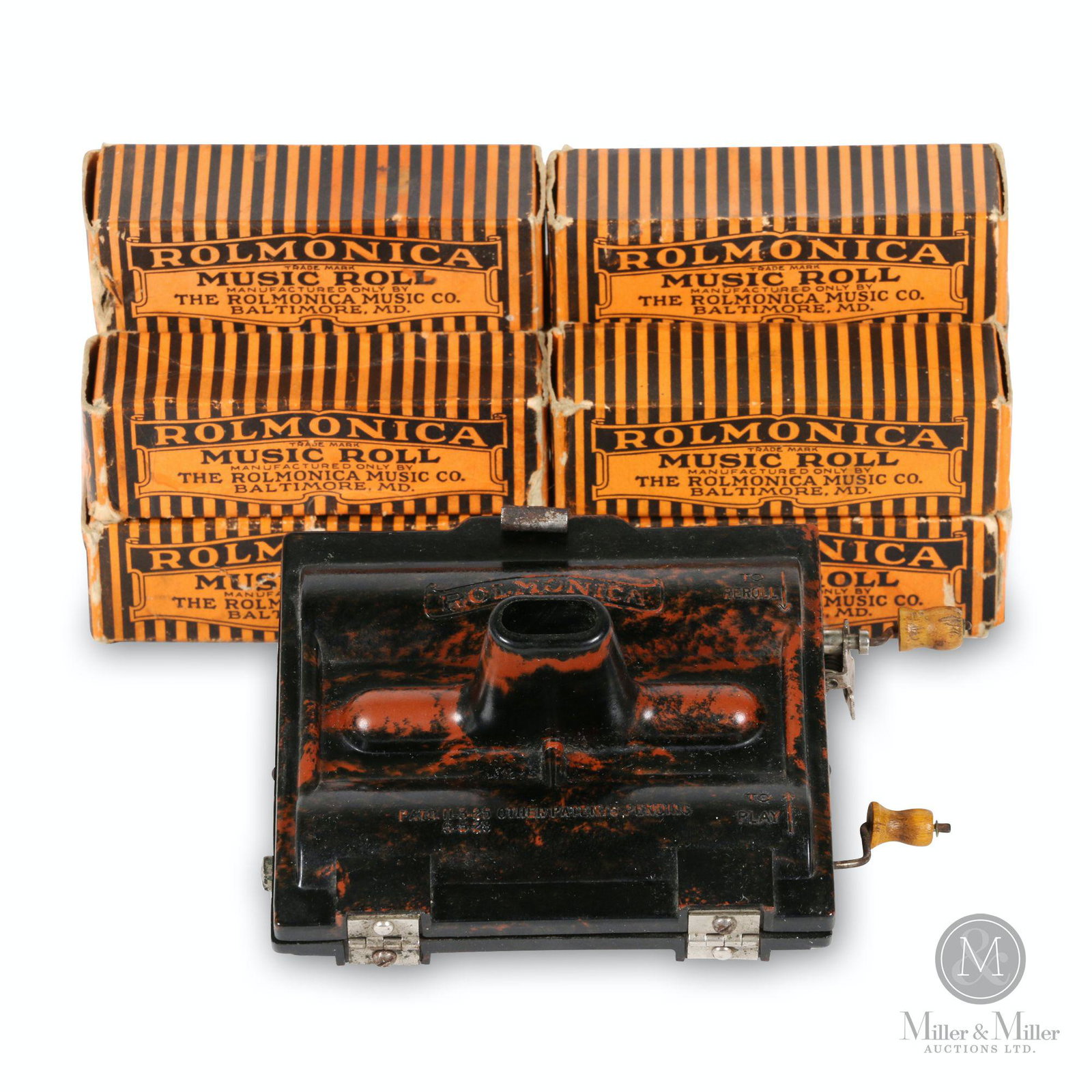 Chromatic Rolmonica Player Harmonica: American. 1928. Bakelite. Includes 10 (Ten) additional boxed rolls. Marked, "Made by the Rolmonica Music Co., Baltimore, MD. 5 x 4.5 x 3". Functioning.