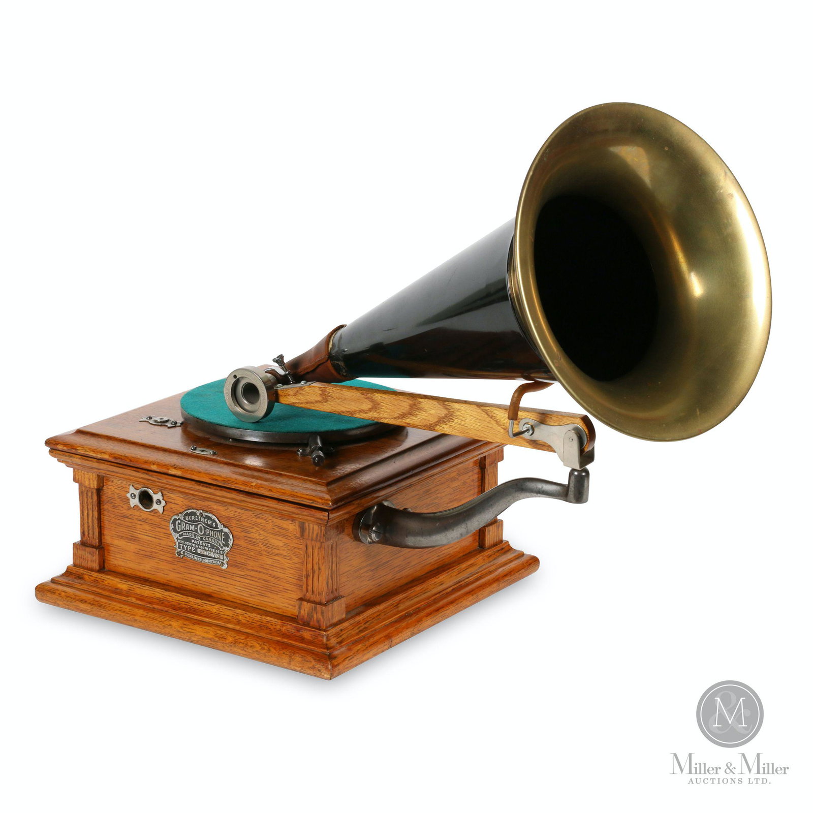 Berliner Model B Gramophone: Canadian. 1900s. Quarter-sawn oak case. Crown badge stamped, "Berliner GRAM-O-PHONE Co. of Canada Ltd. Type B1673 Montreal Pats. 55078 & 55079 Feb 24, 97". Reproducer stamped, "Automatic BERLINER Soun