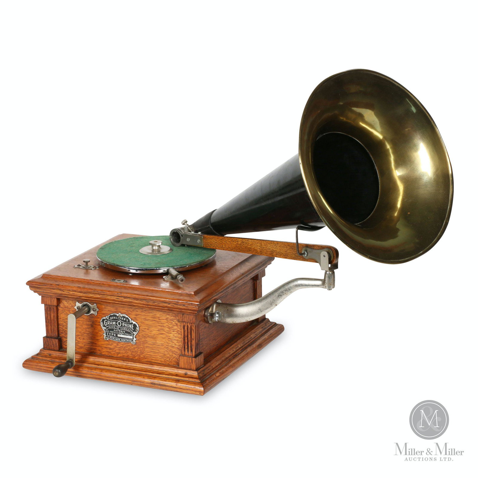 Berliner Model B Gramophone: Canadian. 1900s. Quarter-sawn oak case. Crown badge stamped, "Berliner GRAM-O-PHONE Co. of Canada Ltd. Type B 1159 Montreal Pats. 55078 & 55079 Feb 24, 97". Cabinet 11.25 x 11.25 x 6" (h). Mechanism f