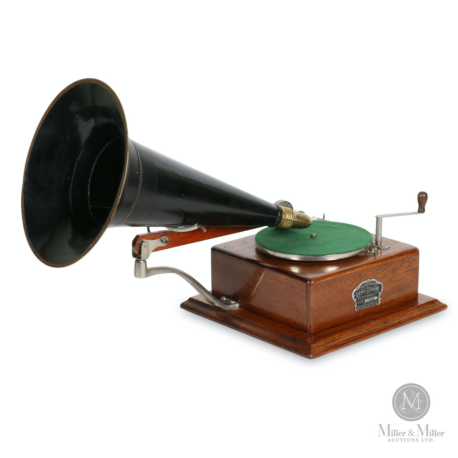 Berliner Model D Gramophone: Canadian. 1583. Quarter-sawn oak case. Features Trademark-type motor, heavier governor/top mounted speed control. Crown badge stamped, "Berliner GRAM-O-PHONE Co. of Canada Ltd. Type D588 Montreal Pats