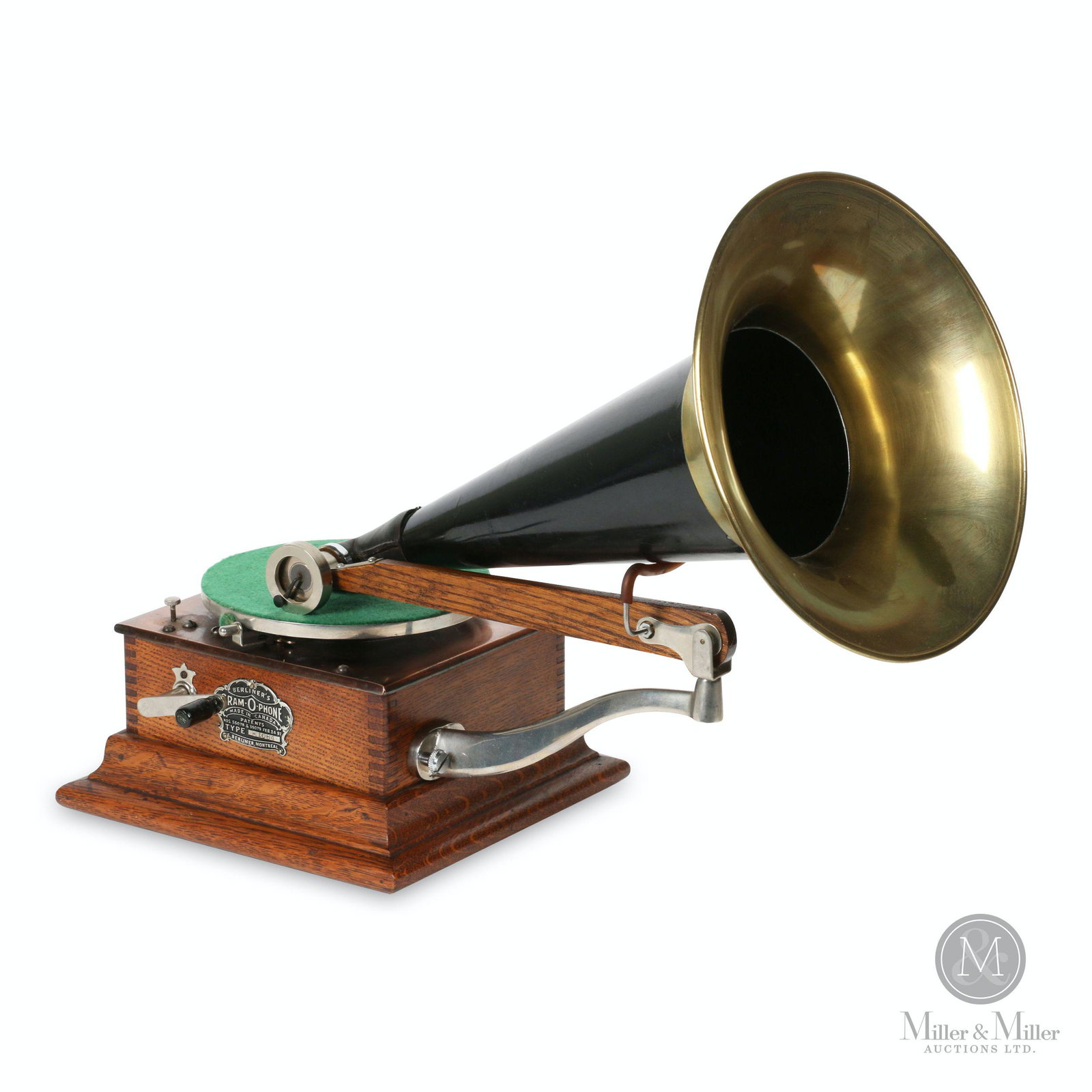 Berliner Model E Gramophone: Canadian. 1900s. Quarter-sawn oak case. Crown badge stamped, "Berliner GRAM-O-PHONE Co. of Canada Ltd. Type Montreal Pats. 55078 & 55079 Feb 24, 97". Reproducer stamped, "Pat'd E. Berliner's 1897". Ba