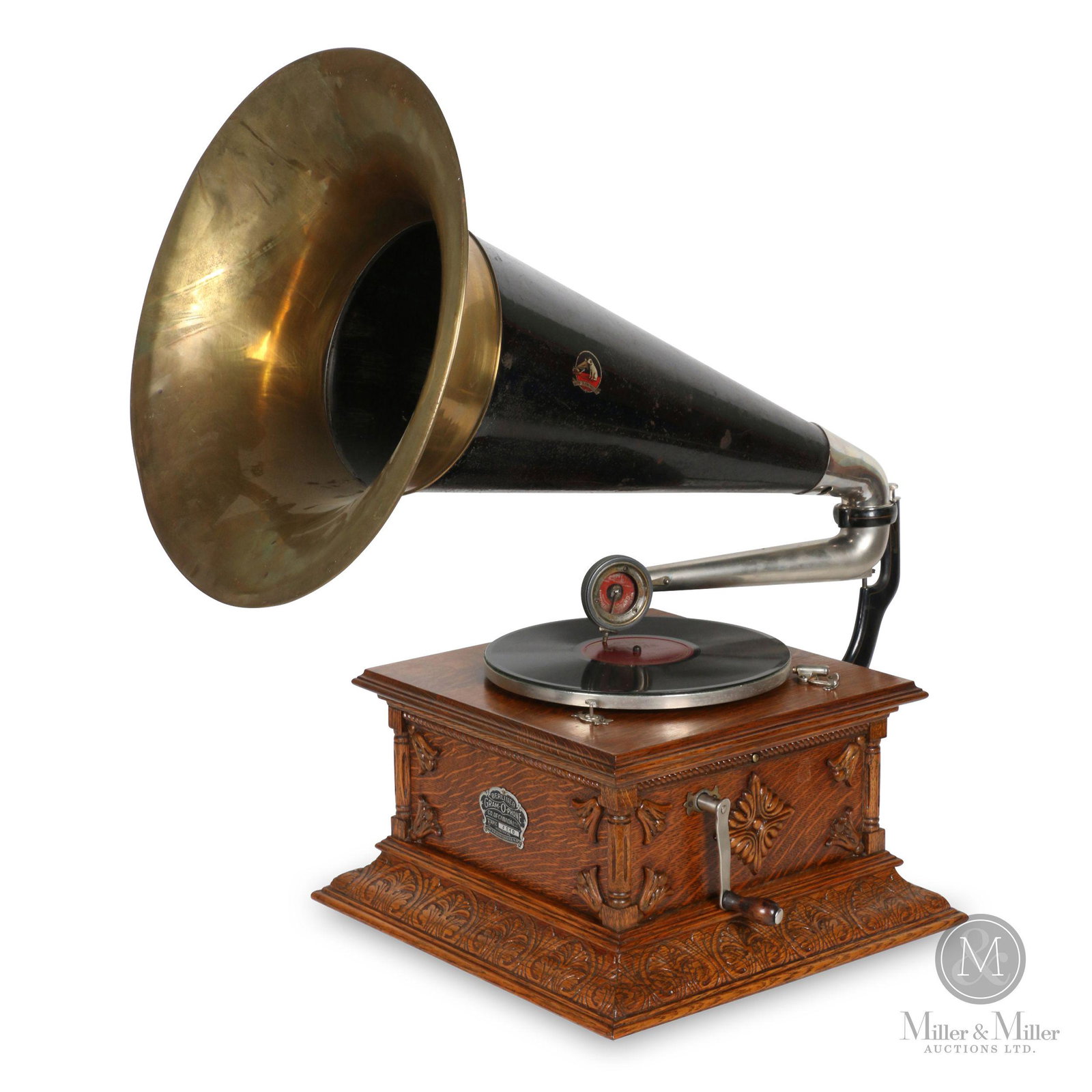 Berliner Type J Gramophone: Canadian. 1900s. Quarter-sawn oak case. Later model. Scissor tone arm. Crown badge stamped, "Berliner GRAM-O-PHONE Co. of Canada Ltd. Type J210 Montreal Pats. 55078 & 55079 Feb 24, 97". Reproducer mar