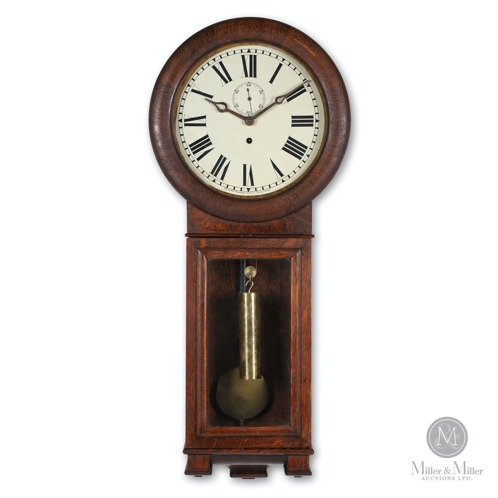 Pequegnat Clock Co. Wall Regulator Clock: Canadian. 1920s. Wall regulator No. I in dark oak case. Metal dial with Roman numerals and seconds bit. Original hands. Eight-day time only regulator movement. Lead-filled brass weight. 36" (h). Requi