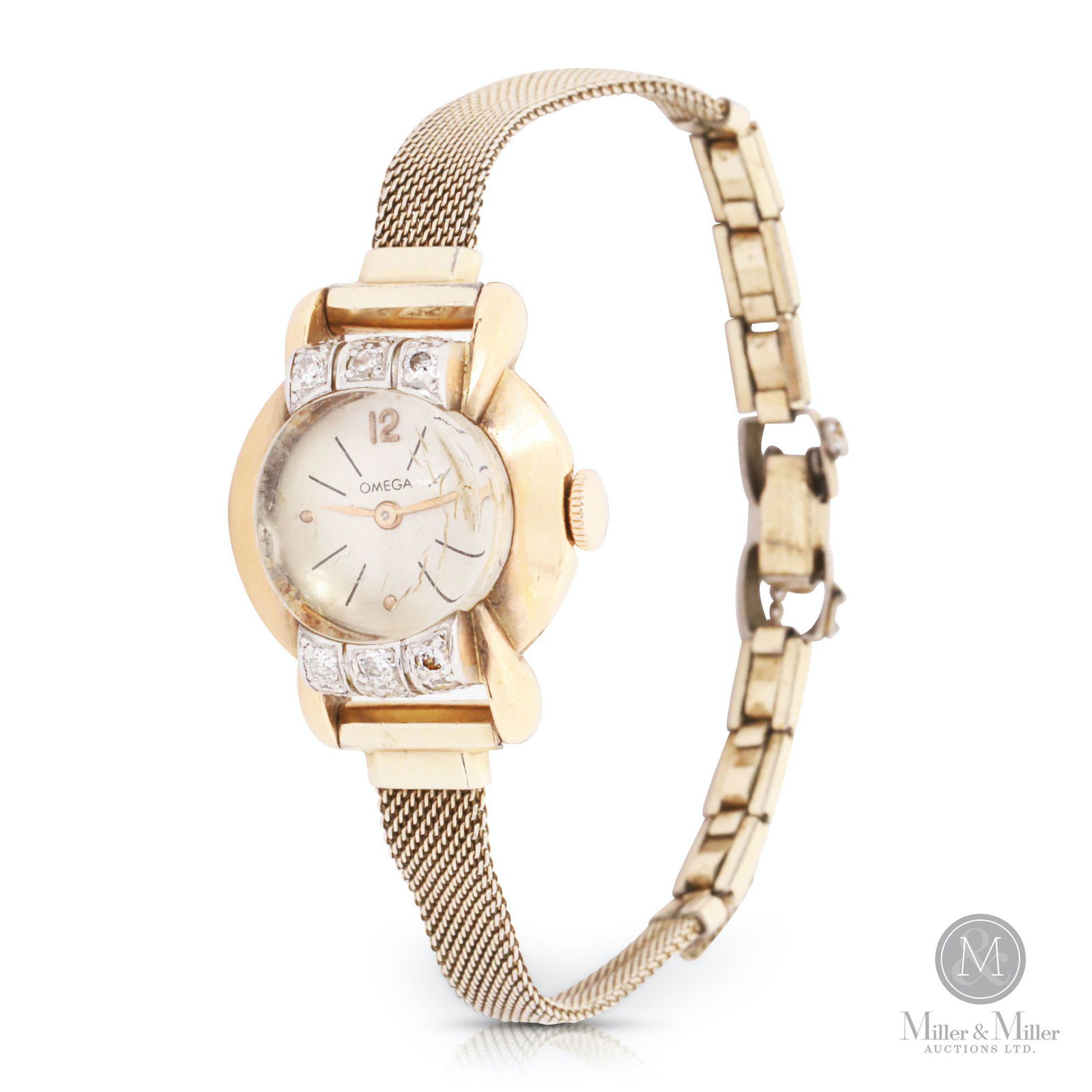 Omega, Ladies 18K Diamond Cocktail Watch: Swiss. 1960s. 18K yellow gold, diamonds. Gross weight 19.9g. Case is 18K gold, band is plated. Case set with 18 diamonds. Caliber 211 movement. Inner caseback hallmarked, "Omega Watch Co. 18K 0.750".