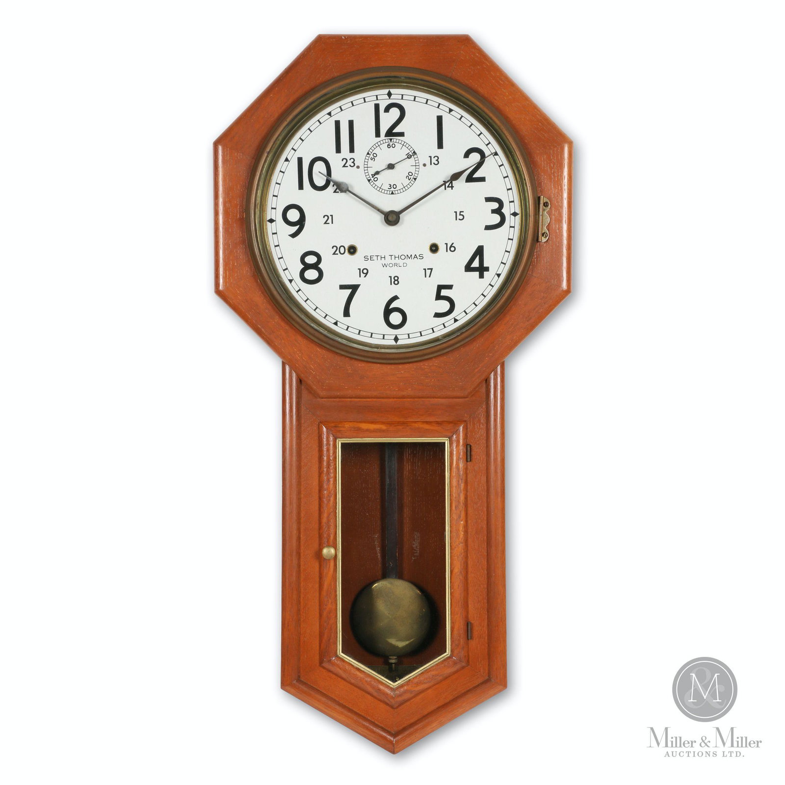 Seth Thomas World 15-Day Office Clock: American. 1930s. Quarter sawn oak. Features 15-day double spring driven movement. 24-Hour Canadian stamped aluminum dial. 16 x 4 x 32" (h). Refinished. Mechanically functioning. CODE-CLO