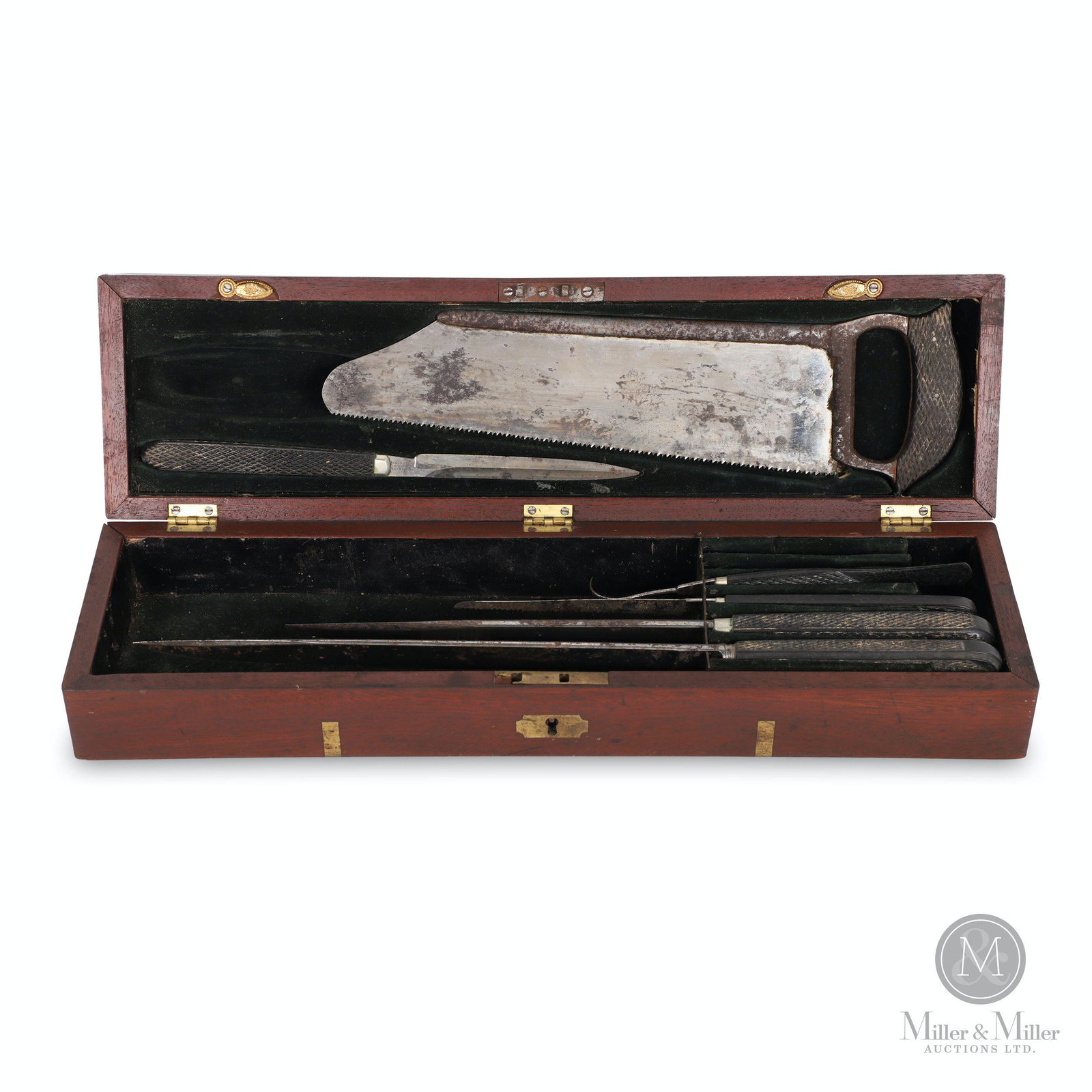 G. Tiemann, N.Y., Cased Post Mortem Tool Kit: American. 1833-1850s. In fitted mahogany case with brass trim. Tag marked "G. Tiemann Manufct of Surgic & Dental Instr 65 Chatham St. N.Y." dates this set to Pre-Civil War. 16 x 4.5 x 3" (H).