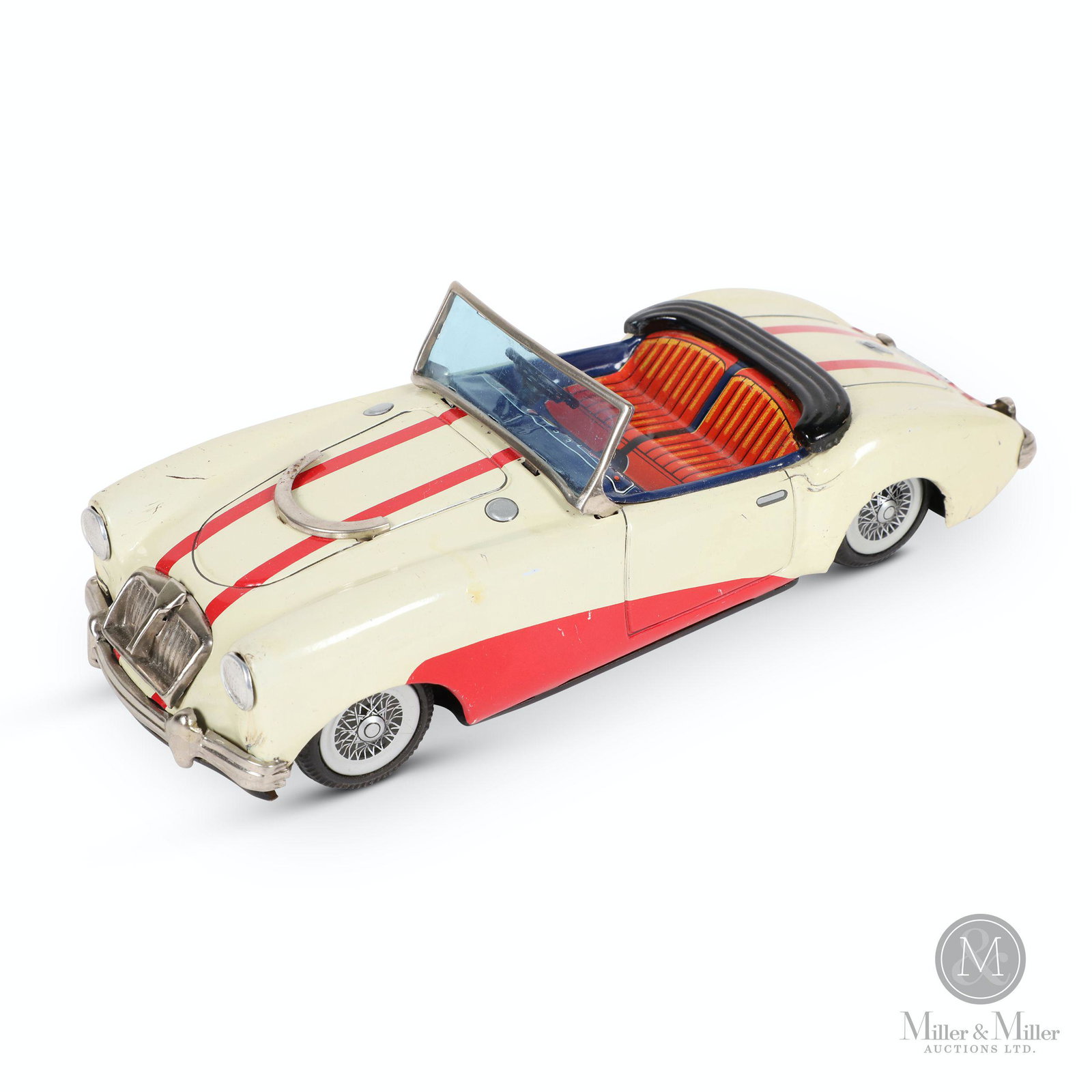 Bandai MGA-1600 MK2 Tin Litho Toy Car: Japanese. 1959-62. Lithographed tin. Features front-wheel drive friction action. Marked, "MGA-600 Mark II - Sign of 'Bandai' Quality - Made in Japan", underside. 8 x 3 x 2.5".