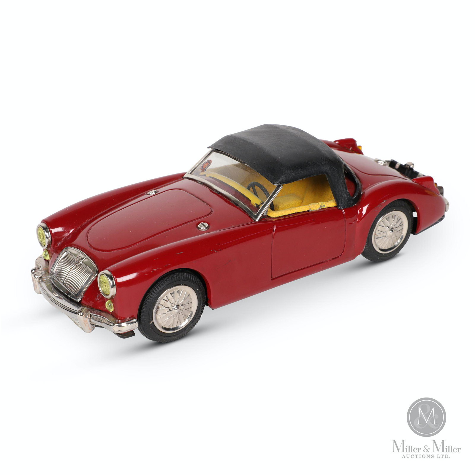 ATC Japan MG 1600 Tin Litho Toy Car: Japanese. 1960s. Lithographed tin. Features rear-wheel drive friction action. Marked, "ATC - Made in Japan", underside rear. 9.5 x 4 x 2.75".