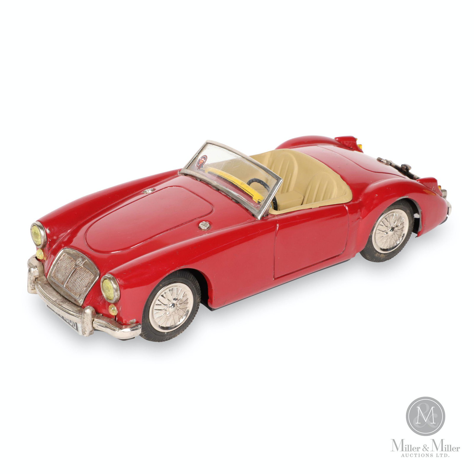 ATC Japan MG 1600 Tin Litho Toy Car: Japanese. 1960s. Lithographed tin. Features rear-wheel drive friction action. Marked, "ATC - Made in Japan", underside rear. 9.5 x 4 x 2.75".