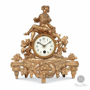 Figural French Mantel Clock: French. 1890s. Gilt spelter case. Dial signed, "E. Lambrechts 1 Rue Terninck Anvers". Dial signed and serialized. 11.5 x 11 x 4". Robert Russell Collection. CODE:CLO