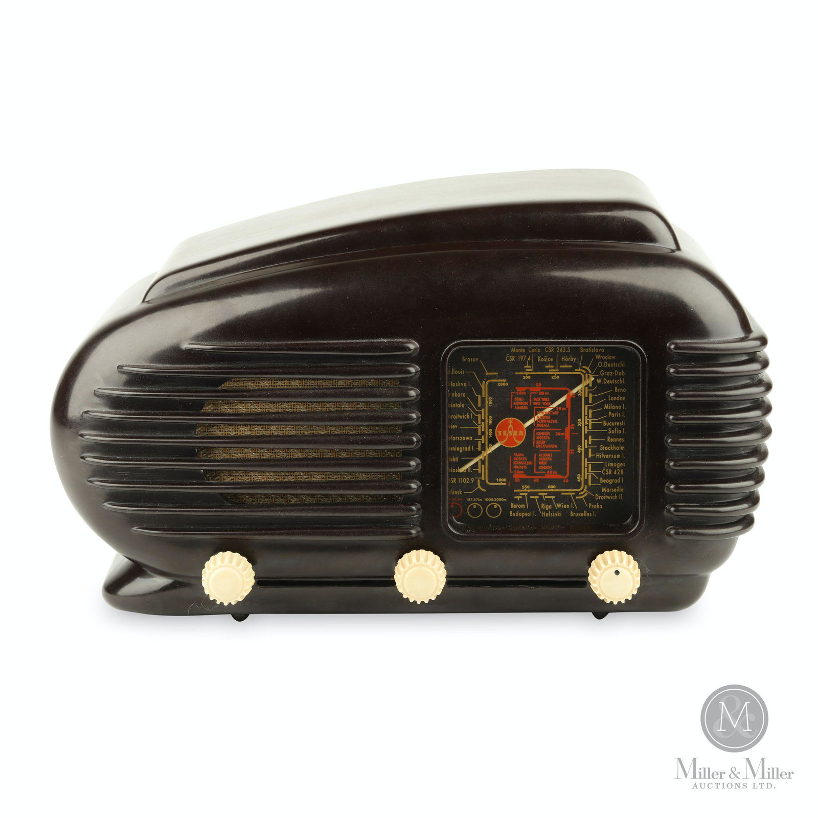 Tesla 308U Talisman Radio: Czechoslovakian. 1953-58. Bakelite. Includes an envelope of spare parts and paperwork related to the radio. Marked, "Tesla 308U Talisman Made in Czechoslovakia" rear. 7 1/2 x 12 x 5 1/2". Functioning.