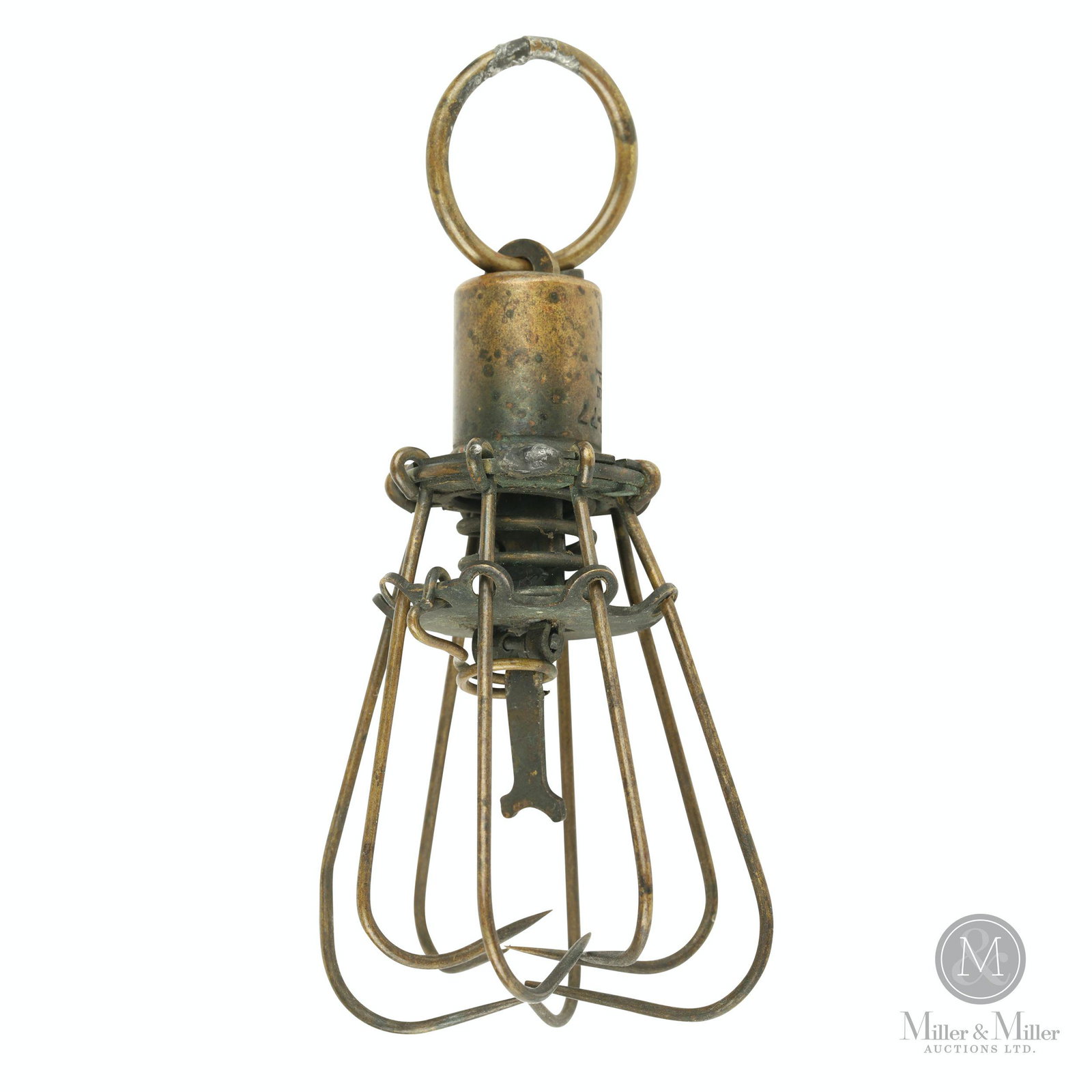 S.W. Evans & Son, Mechanical Fish Trap: American. 1880s. Brass. Pulling the loop spreads the spring-loaded set of hooks apart. Once set, the trap can be set with a bait which triggers the hooks to snap back when taken. Stamped, "Apl 17 -77 