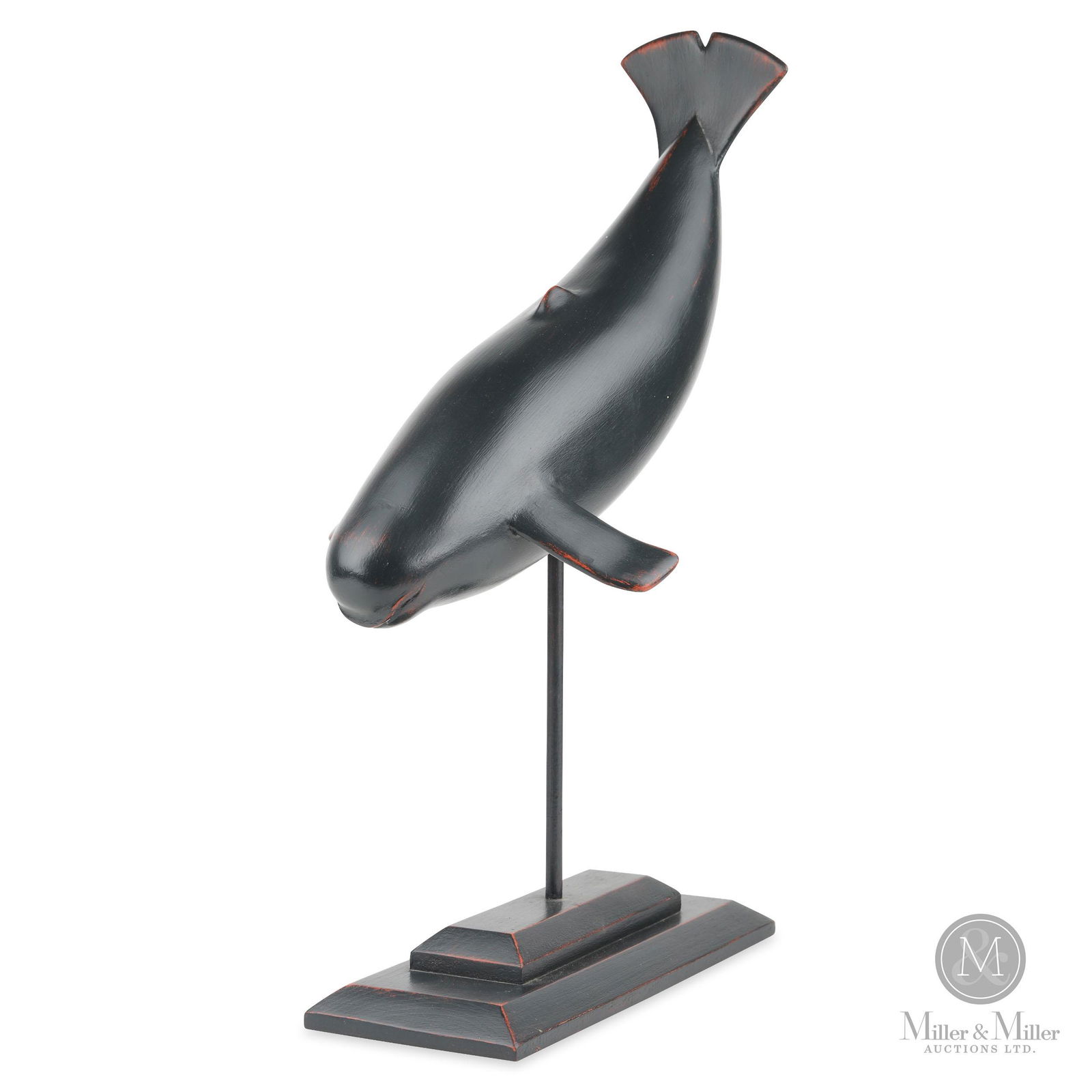 Whale Sculpture by Robert Wylie: A carved whale by Robert Wylie (1932-) of Tillsonburg Ontario. A classic example of Wylie's stylized interpretations. Excellent original condition on original base. Stamped with a W on the underside o