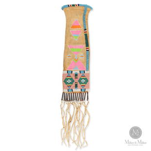 Beaded Crow Pipe Bag: A beaded and painted Crow pipe bag, circa 1920. Great condition, strong colours with fringe having tin cones with glass and metal beads. Ex Mark Francis collection. 4.75" x 18". CODE-TOB