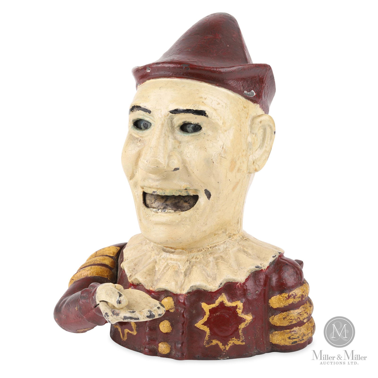 Shepard Hardware Co. Humpty Dumpty Mechanical Bank: Place a coin in the hand and press the lever on the back of the bank. The coin will be deposited into the bank as the eyes roll up and tongue rolls back. From the Tanenbaum Collection. Painted cast ir