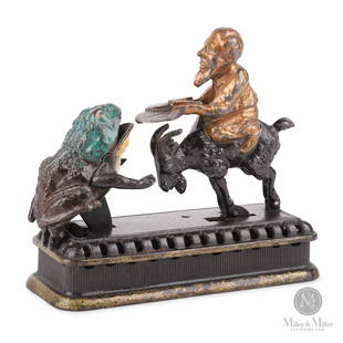 Mechanical Novelty Works, Initiating - Second Degree Mechanical Bank: Set the bank by pressing the goat back upon his haunches. Place coin on the plate held by the rider and touch the goat's tail. The goat immediately springs forward and slings the coin down the frog's