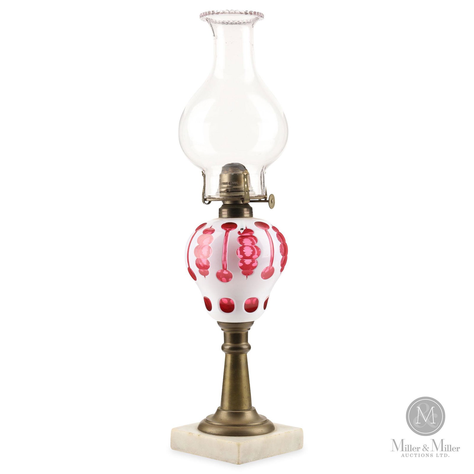 White Cut To Cranberry Moorish Windows Oil Lamp: An unusual example of a well known pattern, this Moorish Windows has an extra cut added to the middle part of the fancy windows. The colours contrast well and it displays on a typical brass and marble
